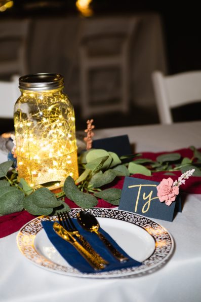 Whimsical and navy reception decorations at backyard wedding reception by Flagstaff wedding photographer PMA Photography.