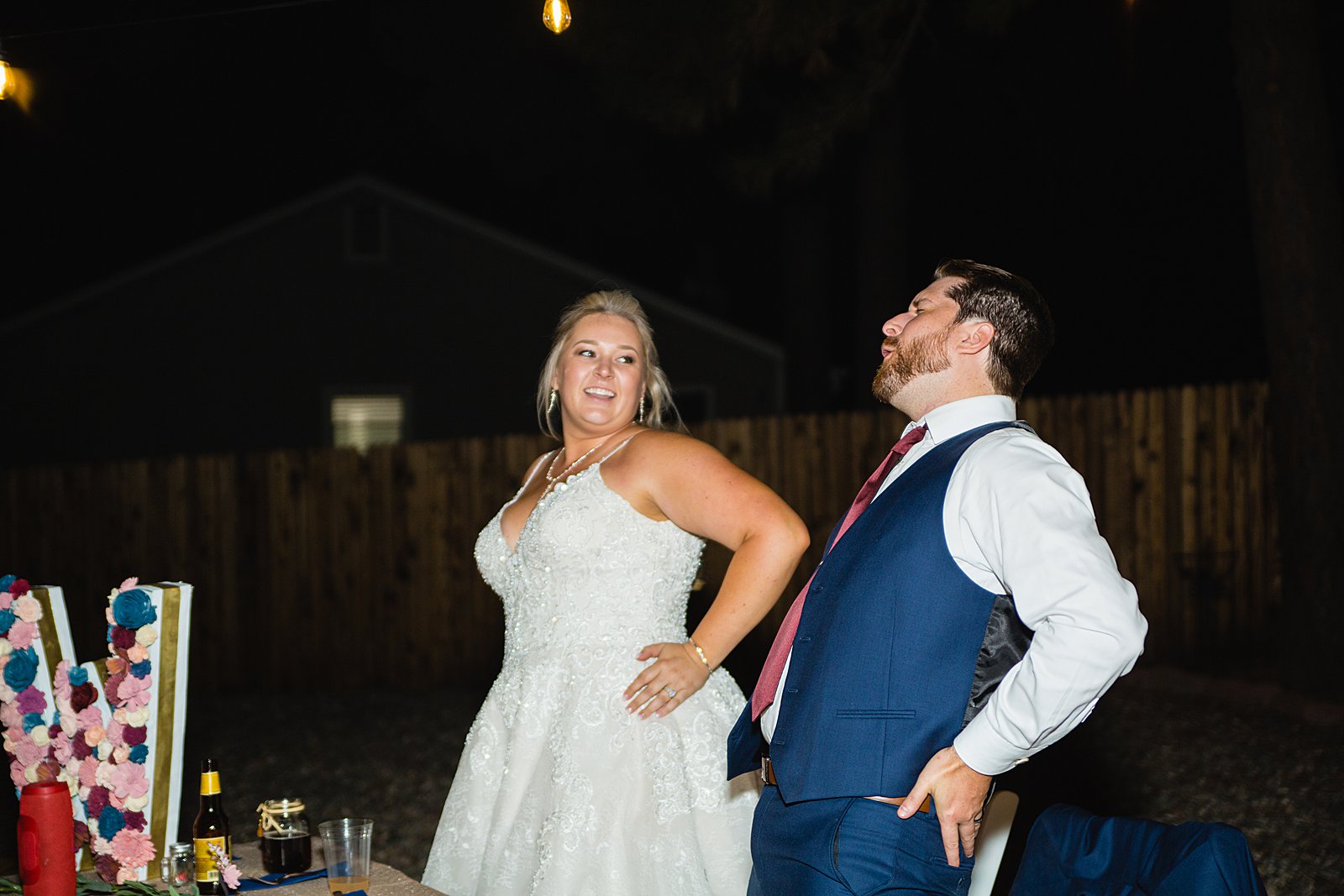 Bride and groom dancing the macarena at their wedding reception by PMA Photography.