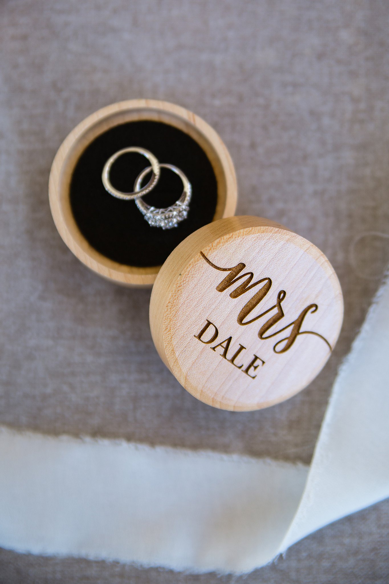 Custom wooden Mrs. ringbox with wedding rings by PMA Photography.