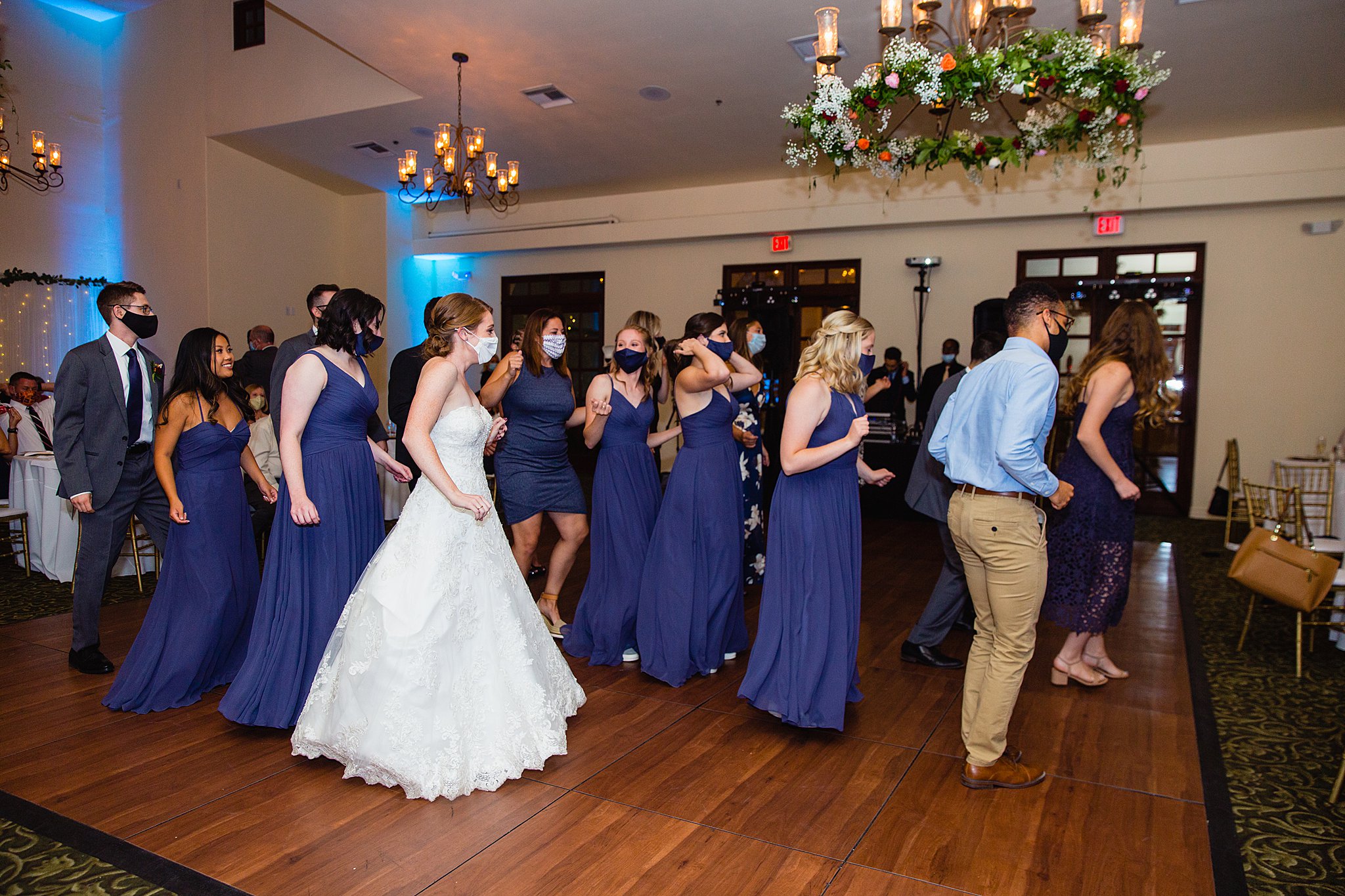 Bride dancing with guests at Secret Garden Events wedding reception by Phoenix wedding photographer PMA Photography