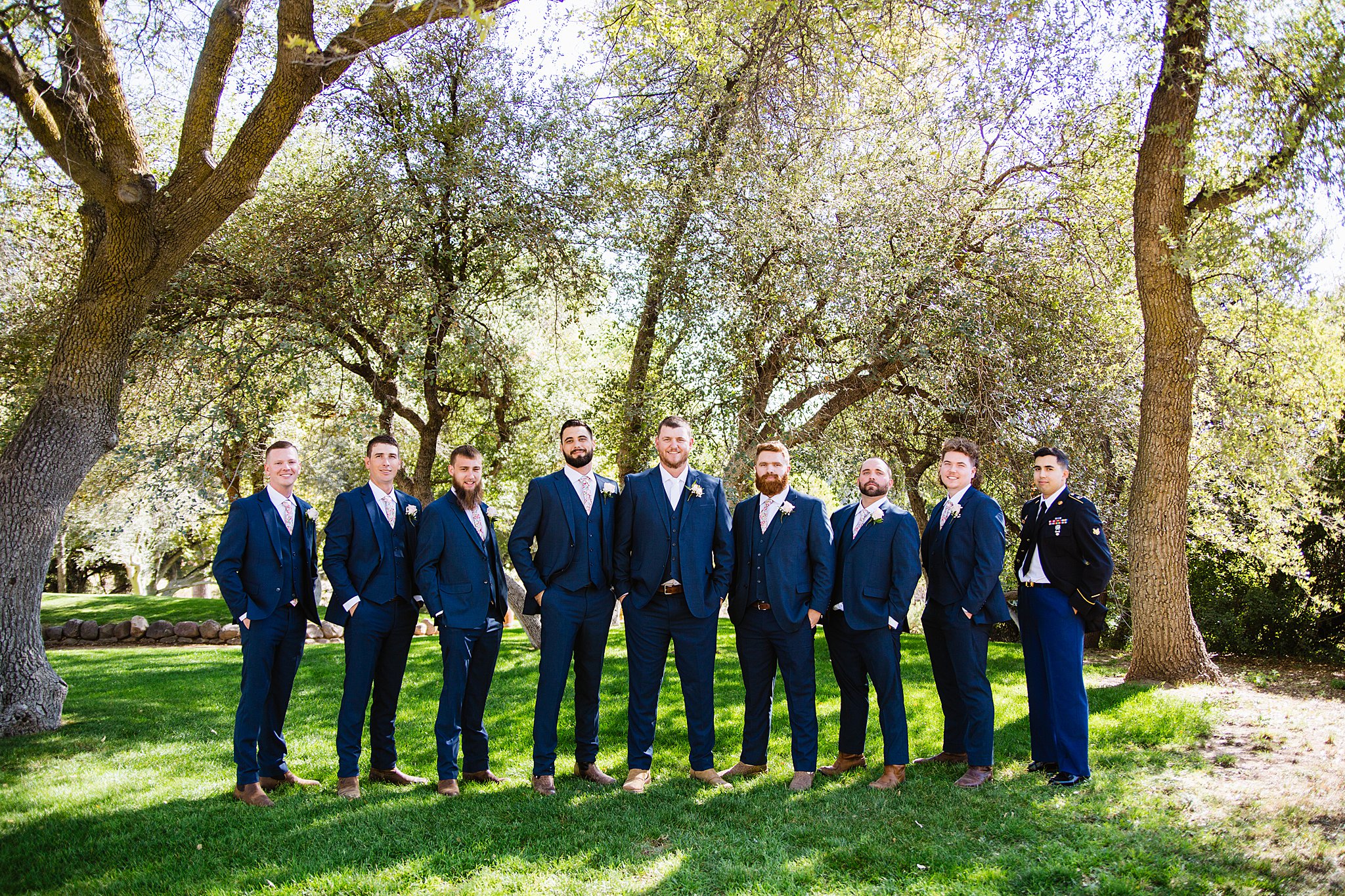 Groom and groomsmen together at a Van Dickson Ranch wedding by Arizona wedding photographer PMA Photography.