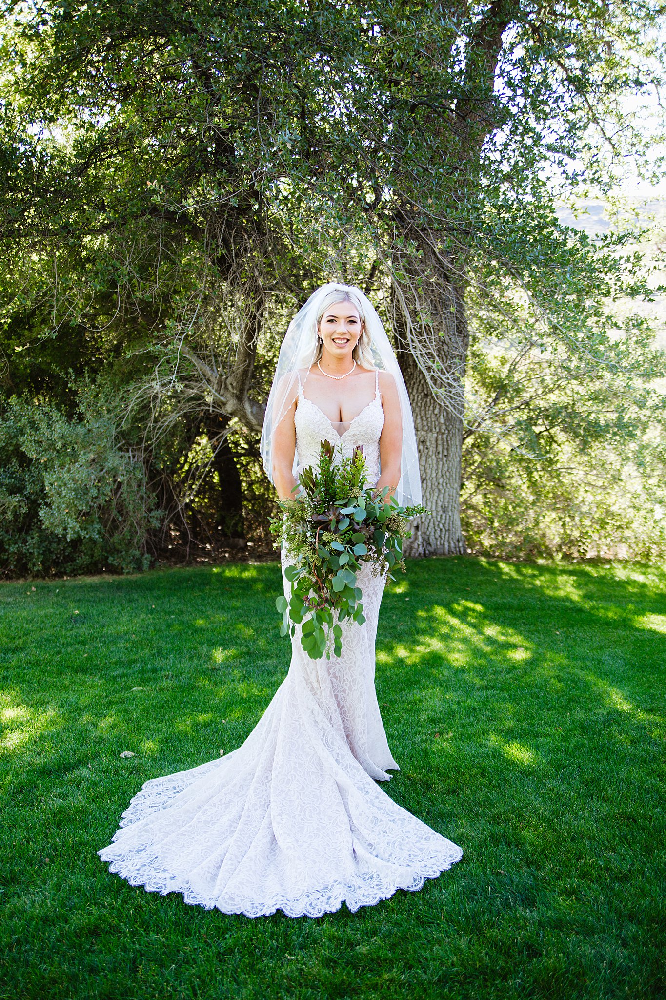 Bride's romantic lace mermaid wedding dress for her Van Dickson Ranch wedding by PMA Photography.