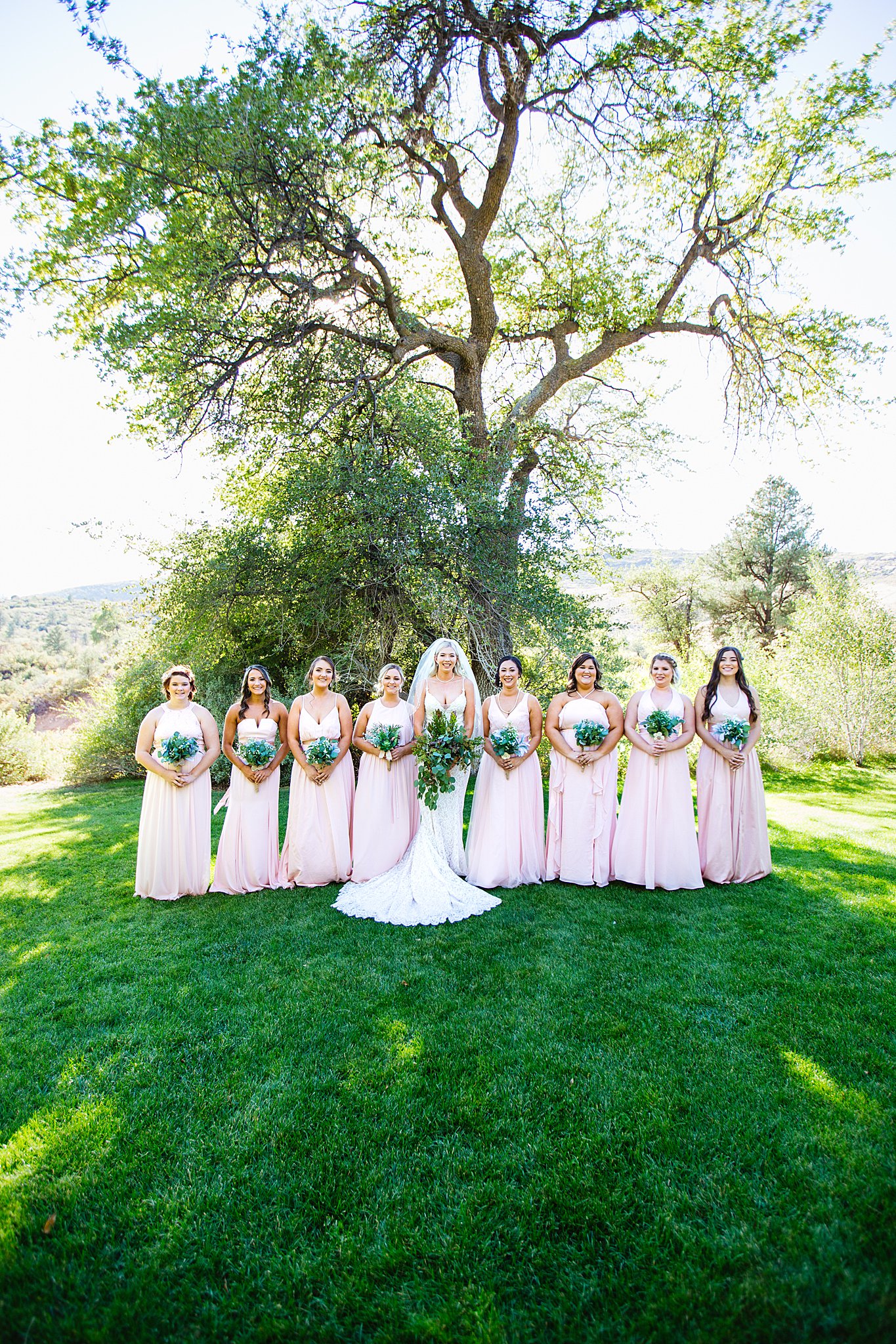 Bride and bridesmaids together at a Van Dickson Ranch wedding by Arizona wedding photographer PMA Photography.