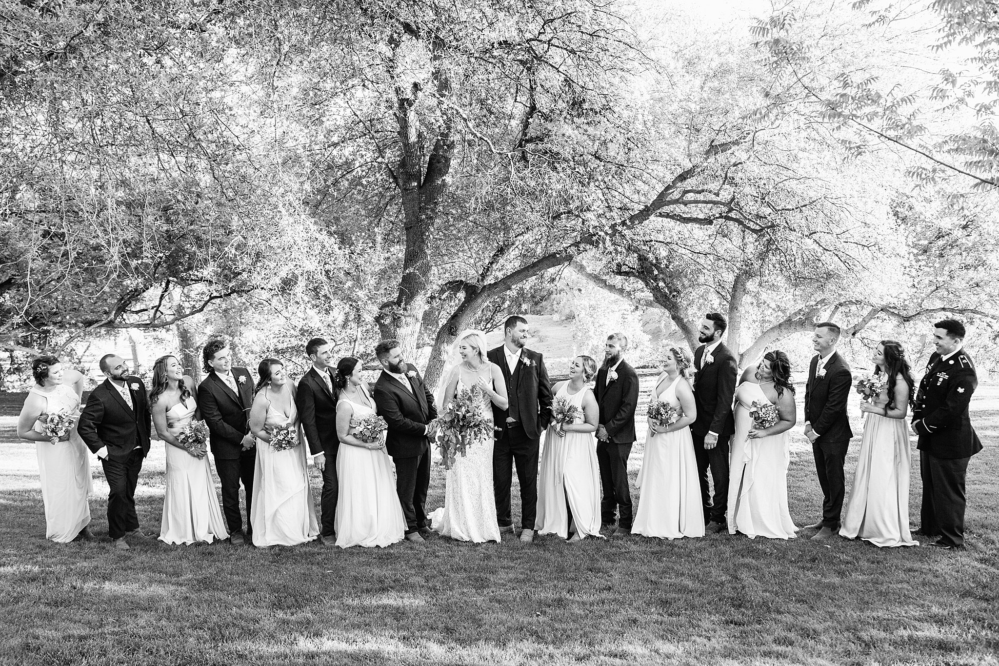 Bridal party laughing together at Van Dickson Ranch wedding by Skull Valley wedding photographer PMA Photography.