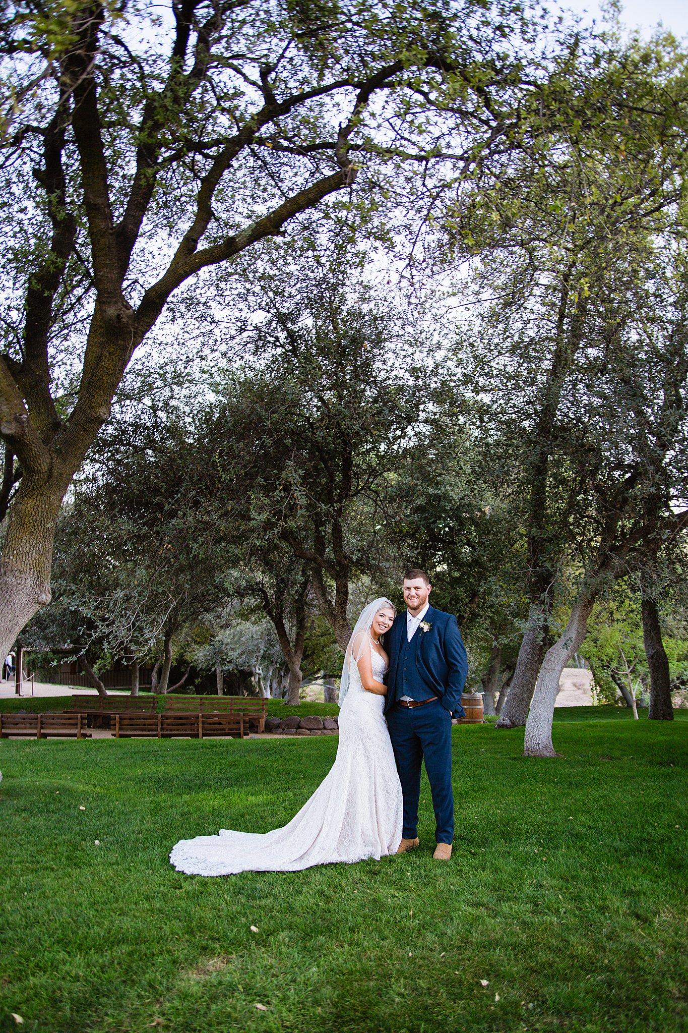Bride and Groom pose during their Van Dickson Ranch wedding by Arizona wedding photographer PMA Photography.