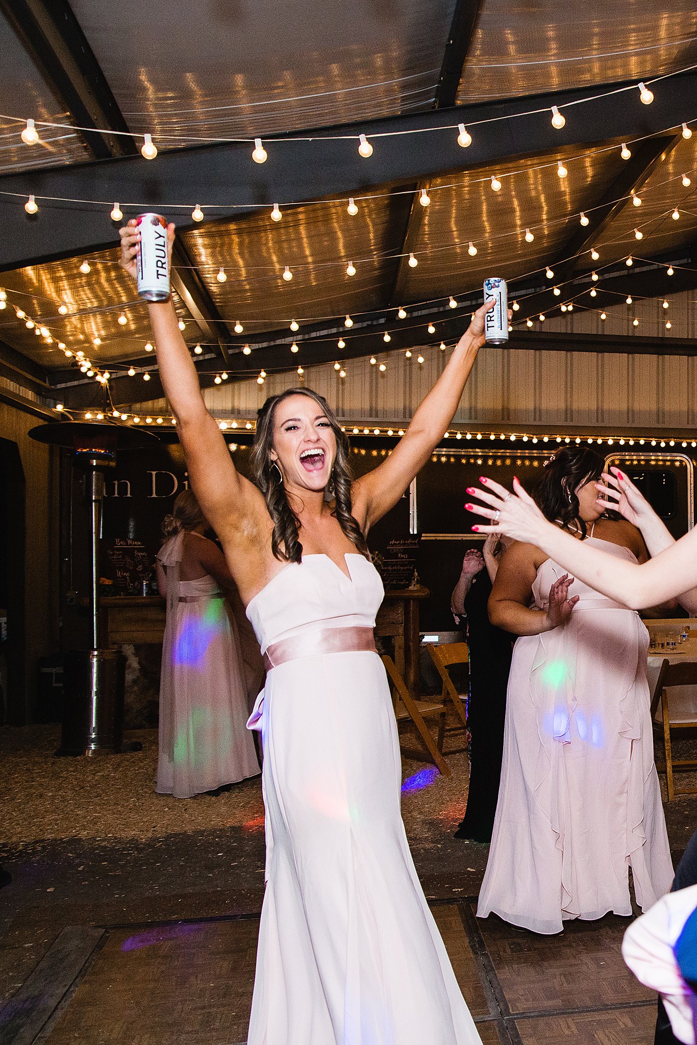 Guests dancing at a Van Dickson Ranch wedding reception by Arizona weding photographer PMA Photography.