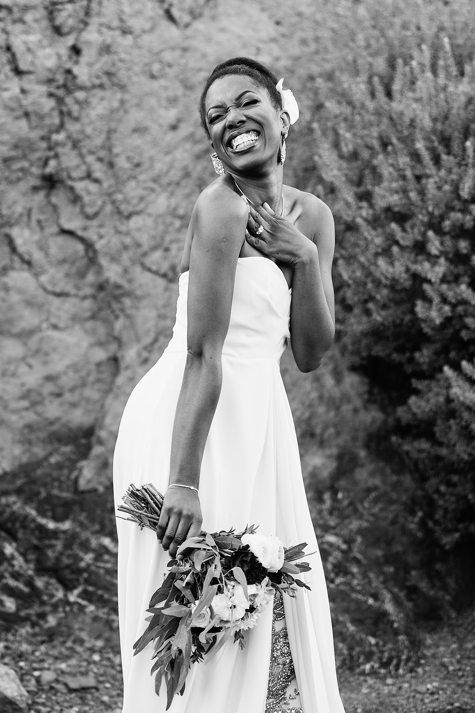Bride laughing in her wedding dress for her multicultural wedding by PMA Photography.