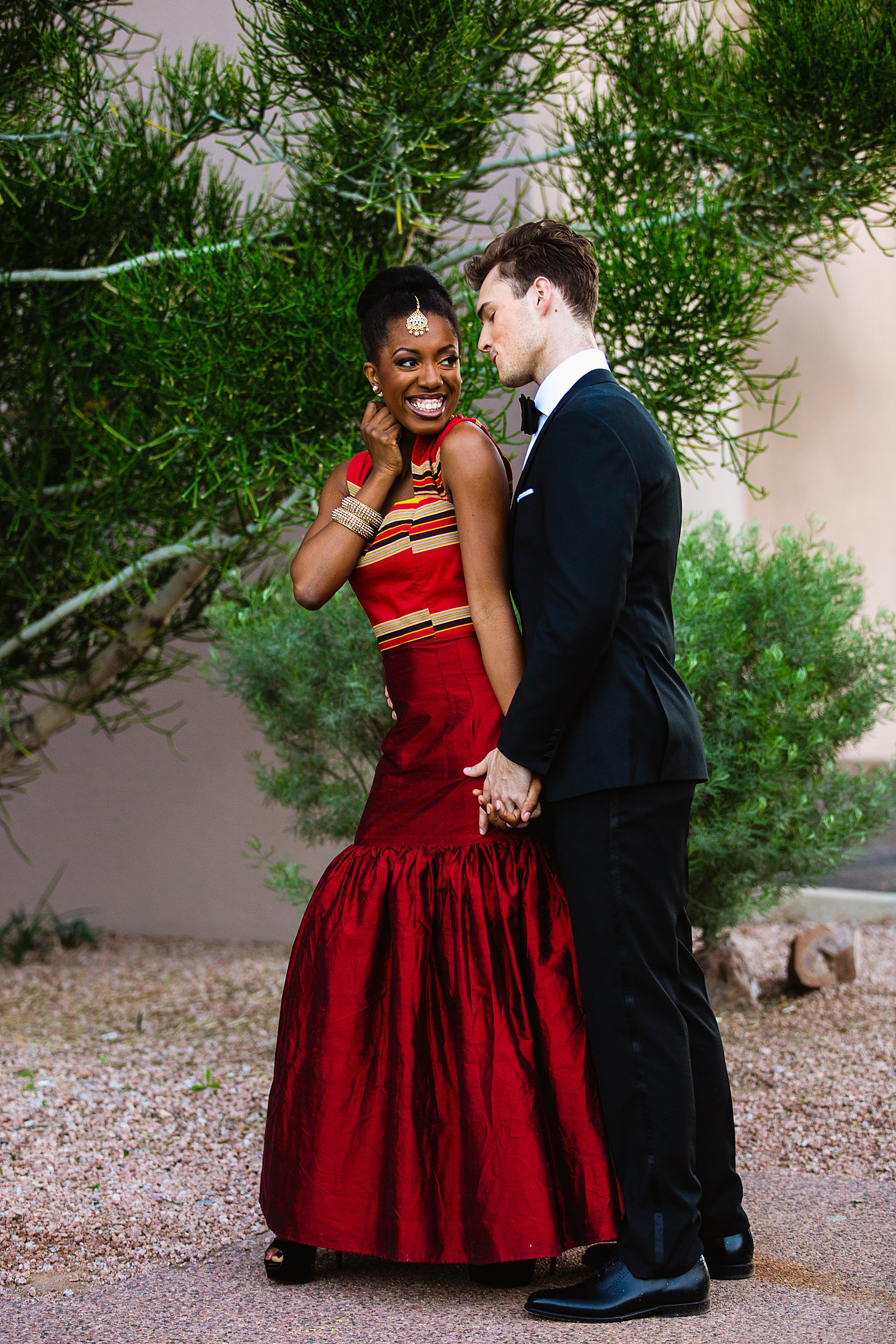 Bride and Groom pose during their multicultural wedding by Arizona wedding photographer PMA Photography.