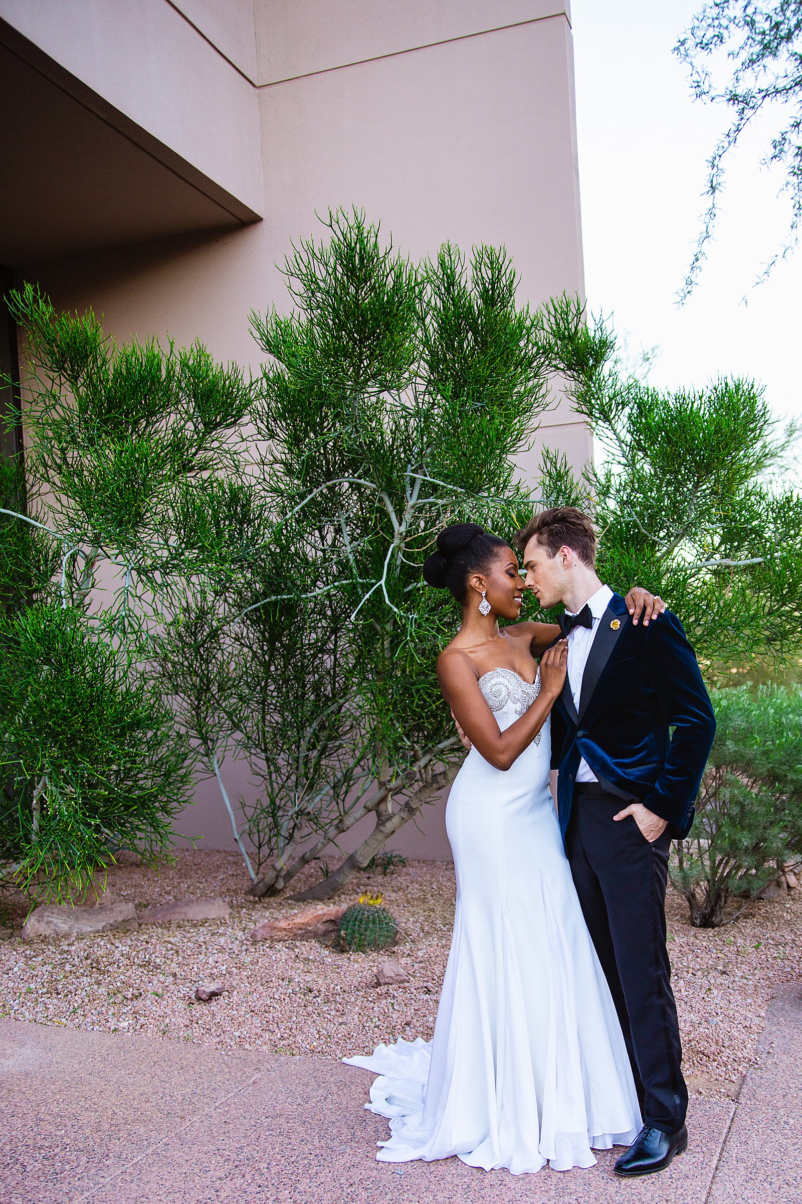Bride and Groom pose during their multicultural wedding by Arizona wedding photographer PMA Photography.