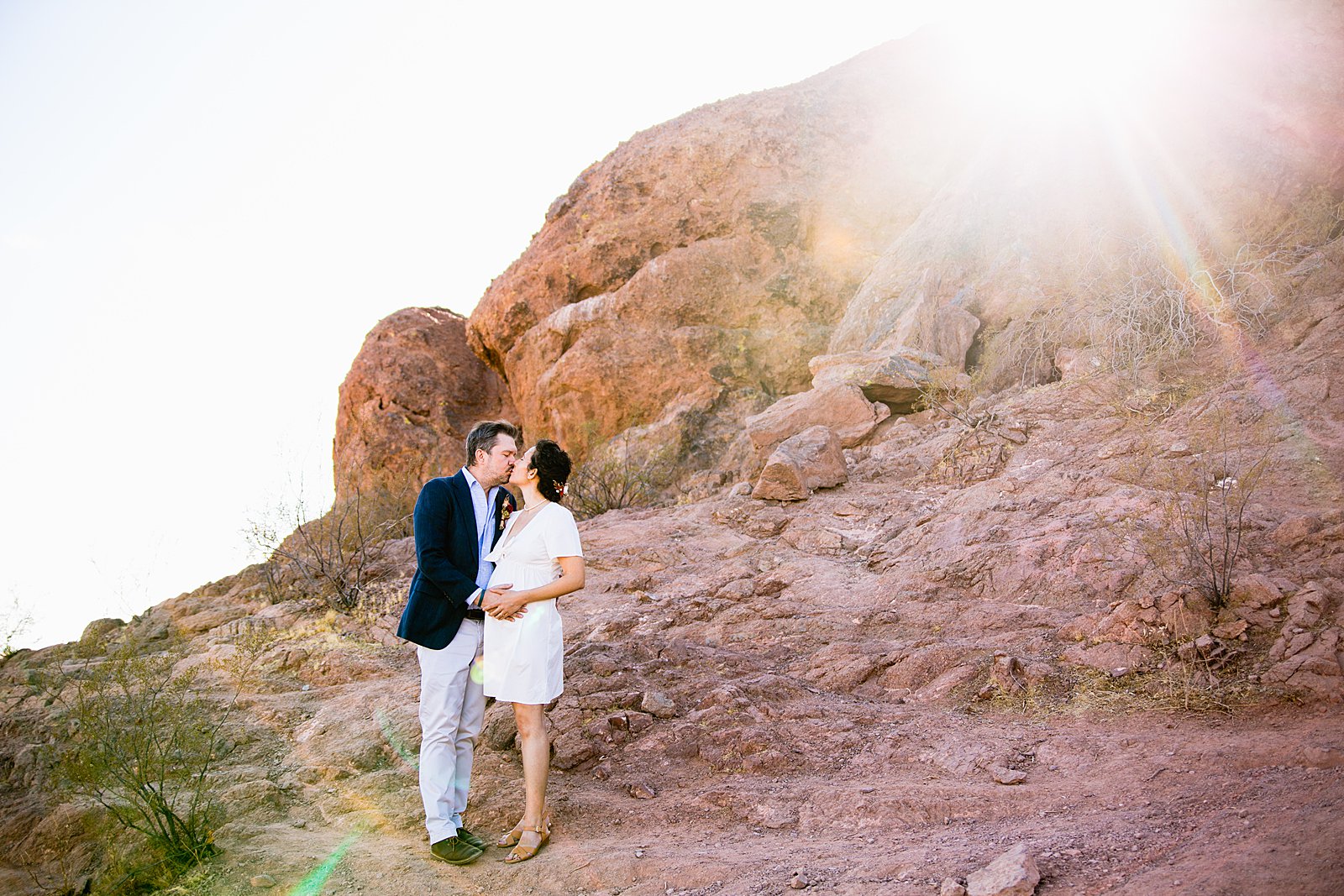 Bride and Groom share a kiss during their Papago Park elopement by Arizona elopement photographer PMA Photography.