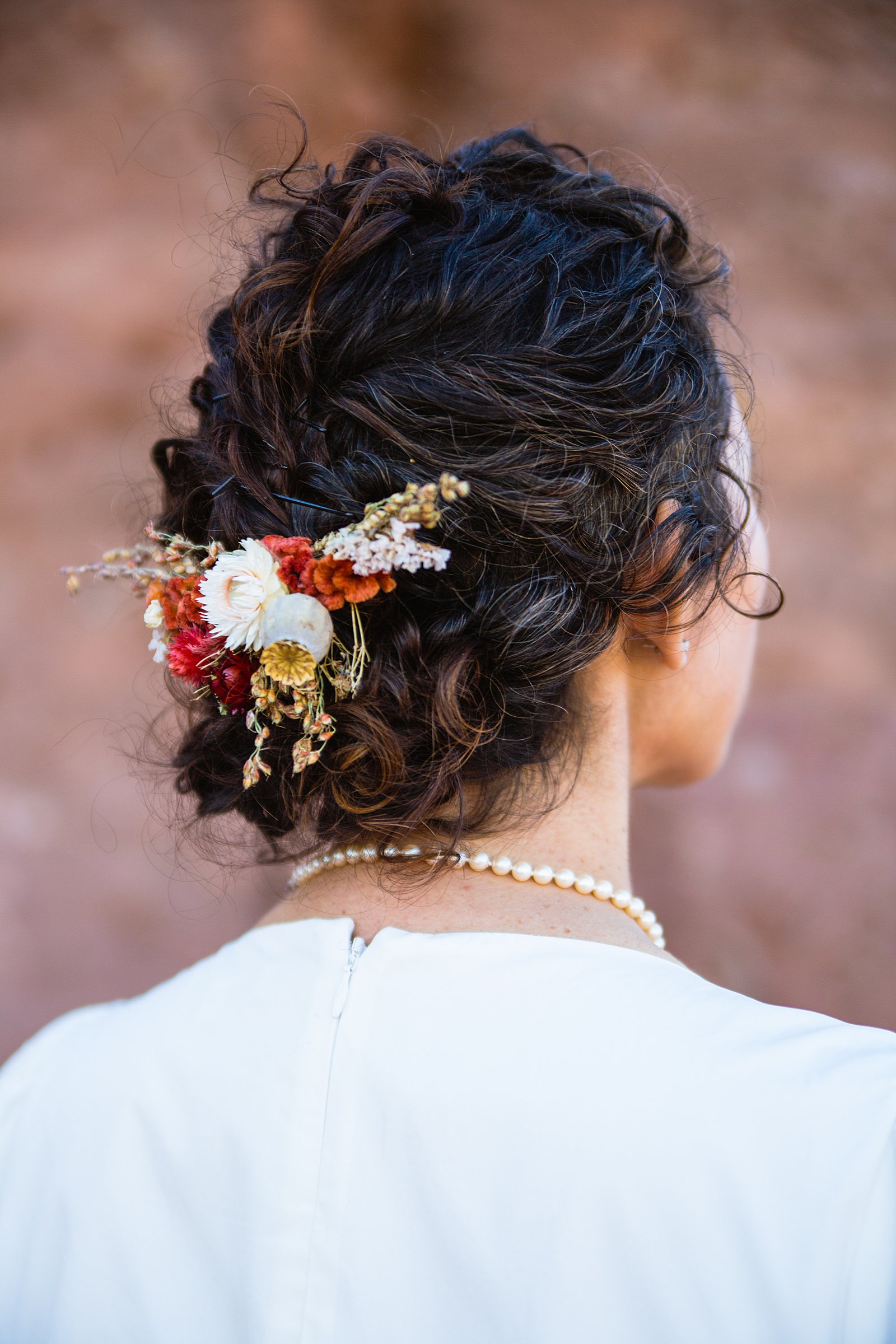 Bride's fall inspired dried flower hair piece by PMA Photography.