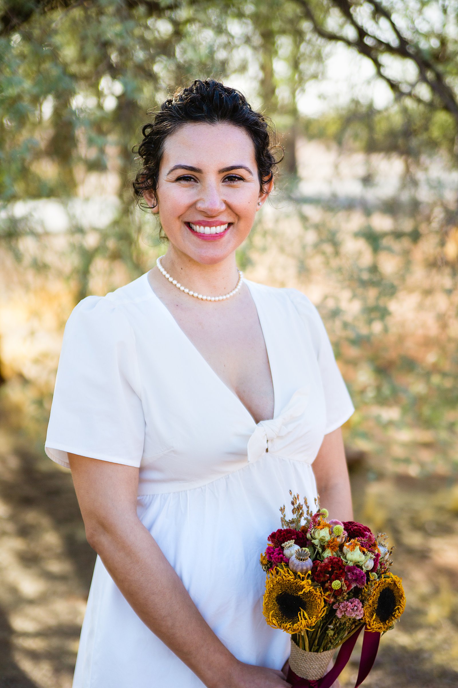 Bride's simple wedding dress for her Papago Park elopement by PMA Photography.
