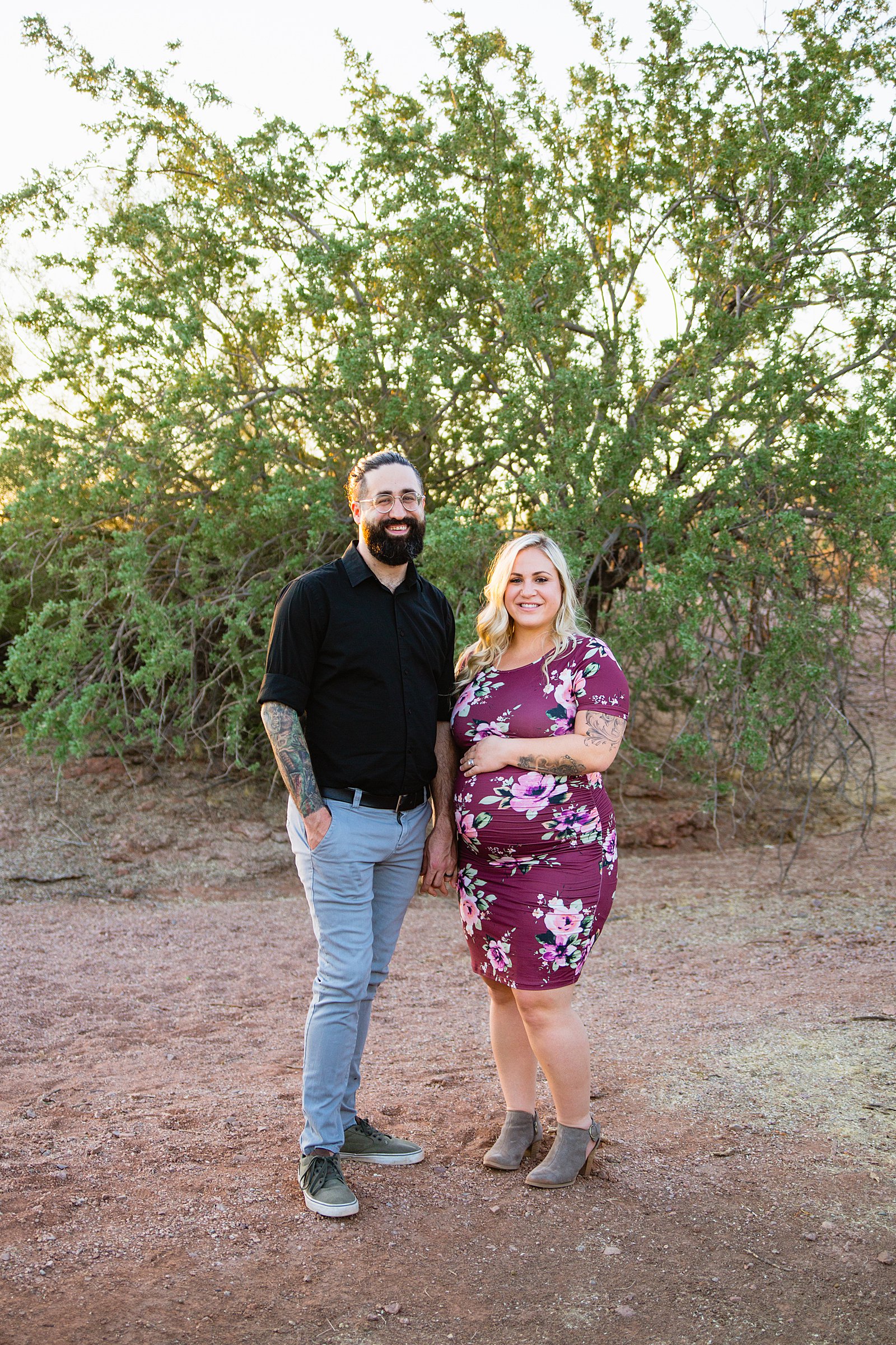 Couple pose for their Papago Park maternity session by Phoenix wedding photographer PMA Photography.