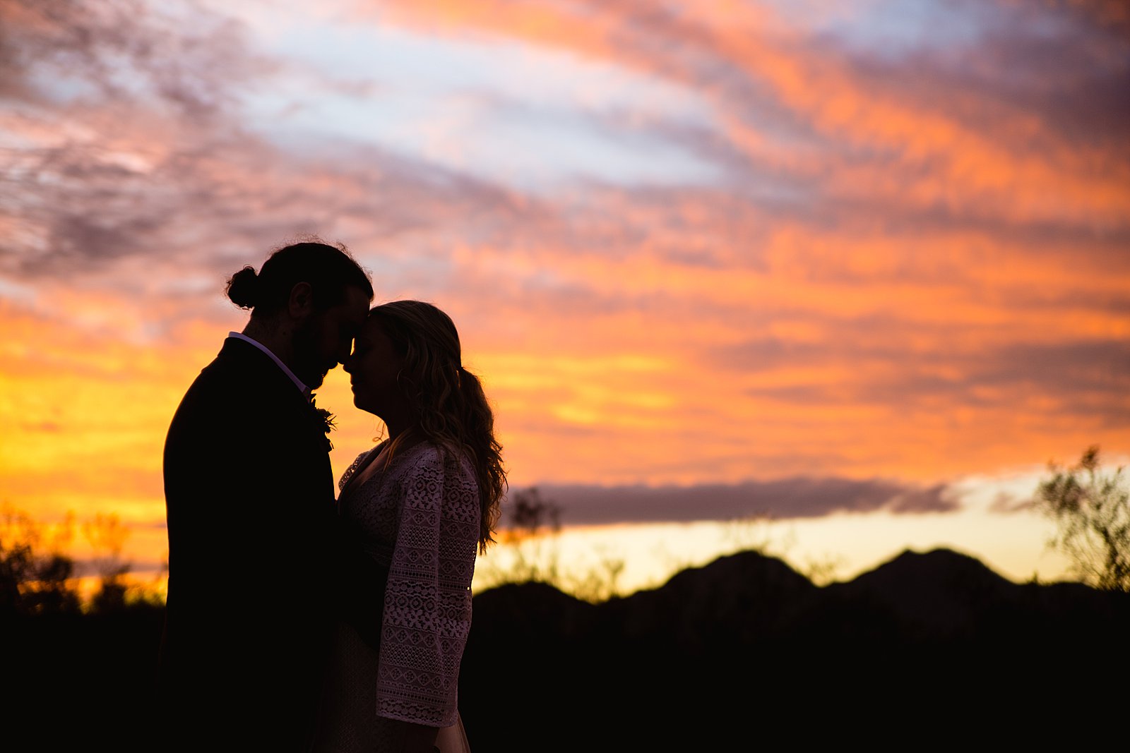 Bride and Groom share an intimate moment at their San Tan Regional Park wedding by Arizona wedding photographer PMA Photography.