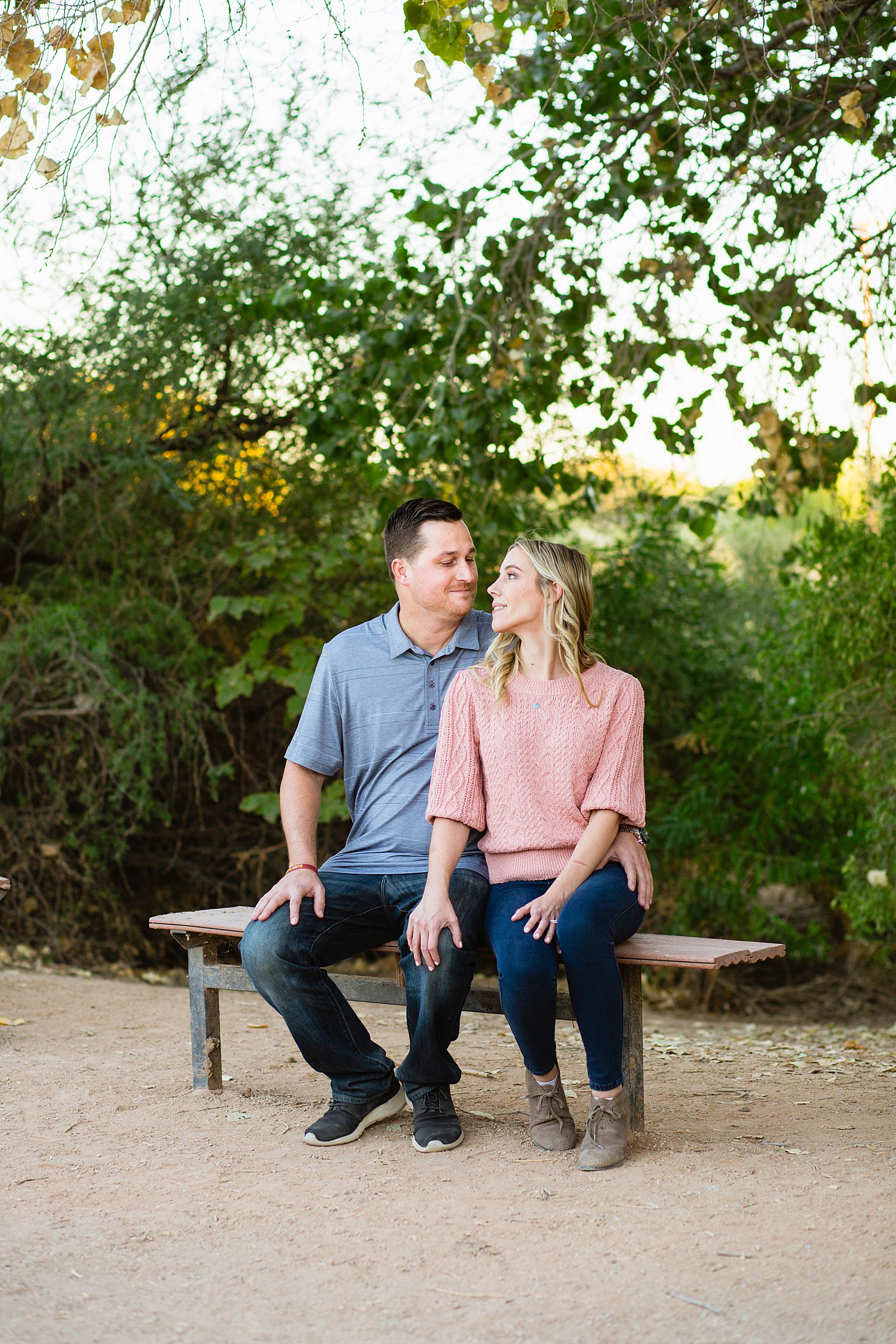 Couple pose during their Gilbert engagement session by Arizona wedding photographer PMA Photography.