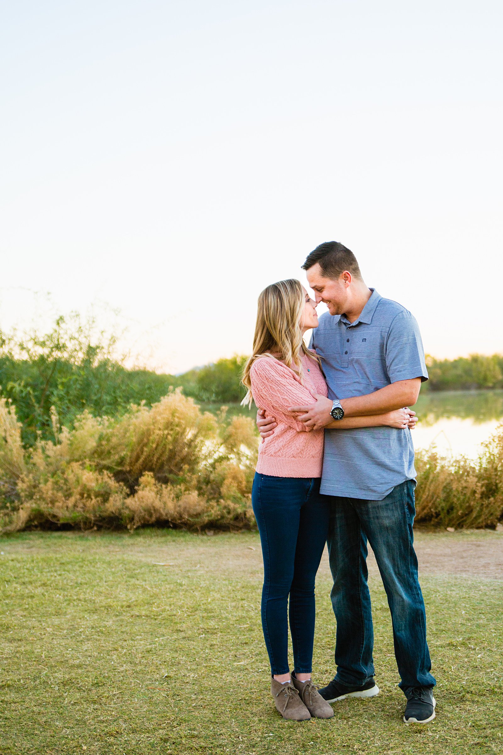 Couple share an intimate moment at their Gilbert engagement session by Arizona engagement photographer PMA Photography.