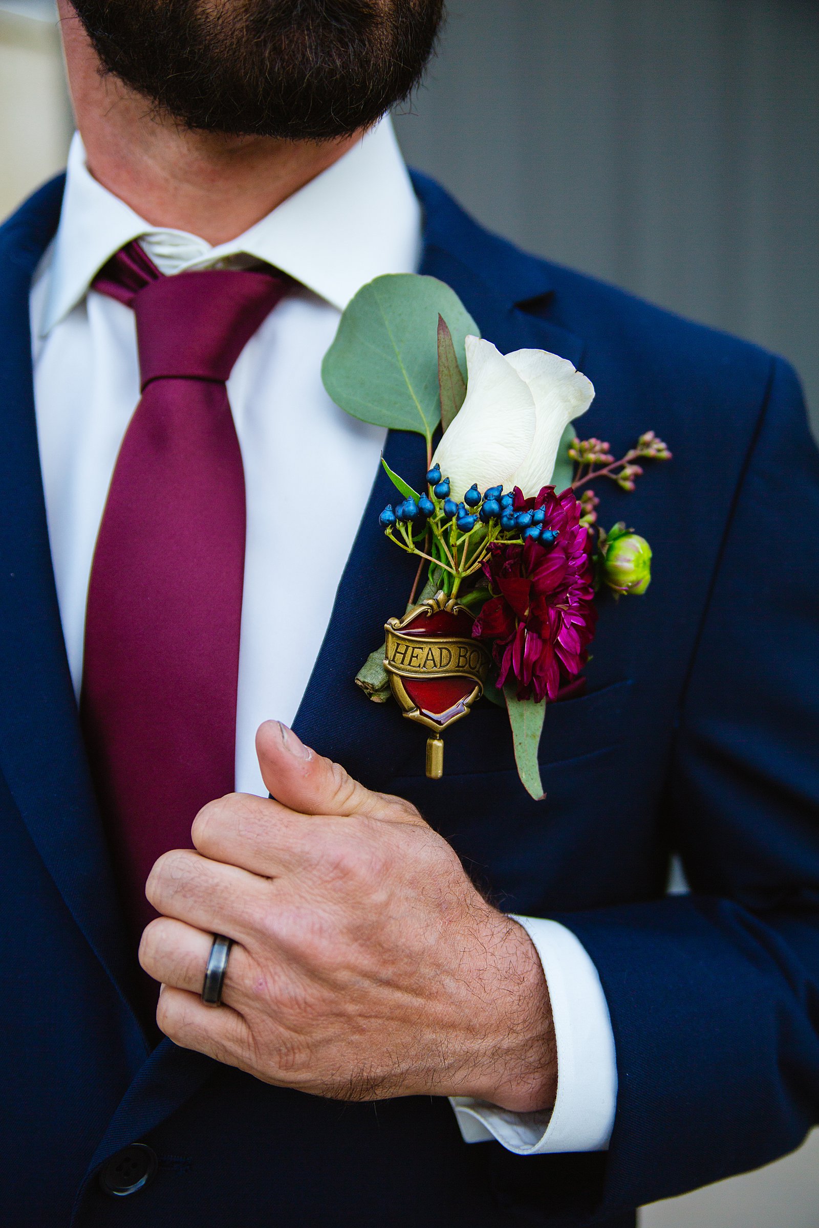 Groom's navy suit for his jewel toned wedding by Phoenix wedding photographers PMA Photography.
