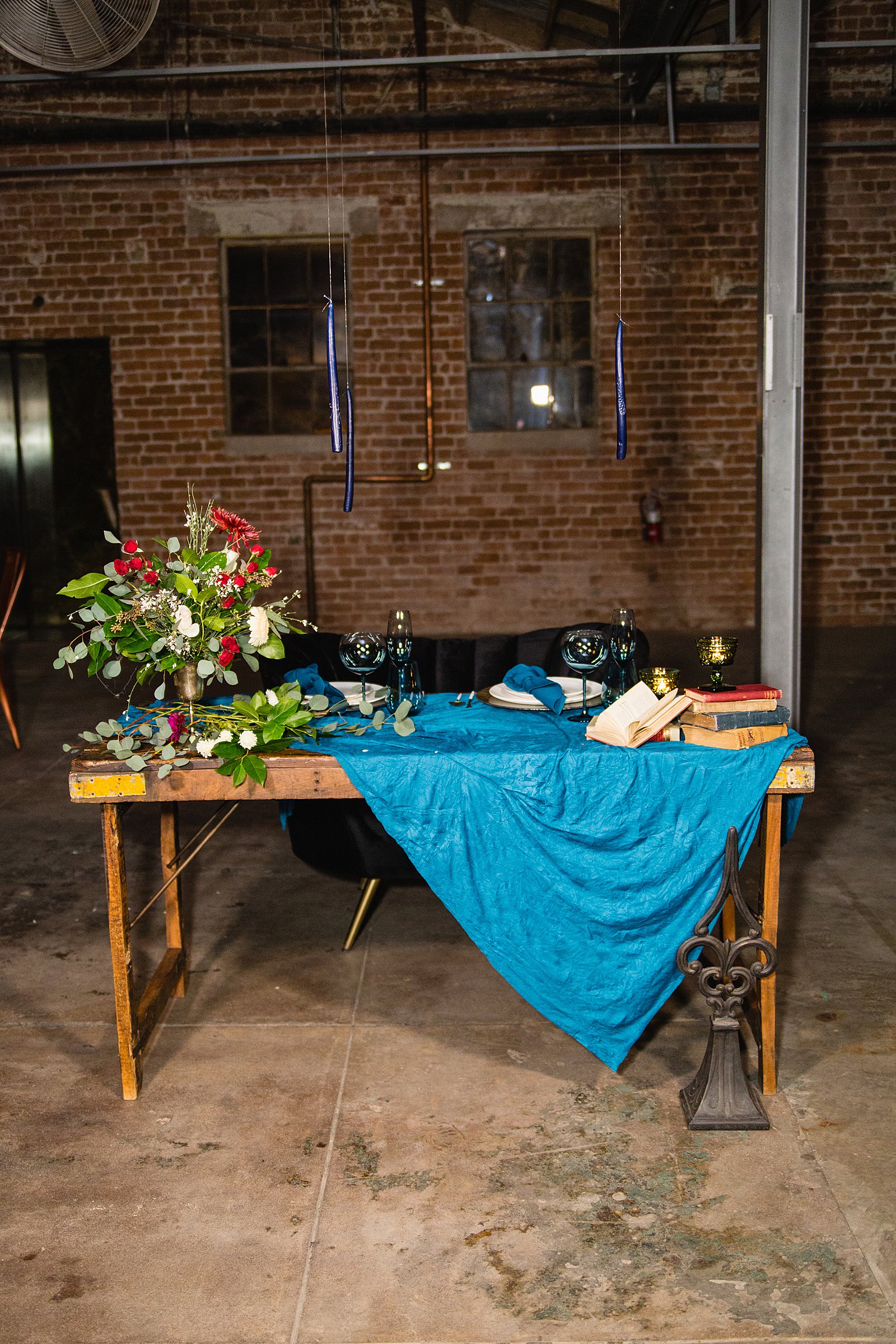 Jewel toned Harry Potter inspired sweetheart table at Sunkist Warehouse by Arizona wedding photographer PMA Photography.