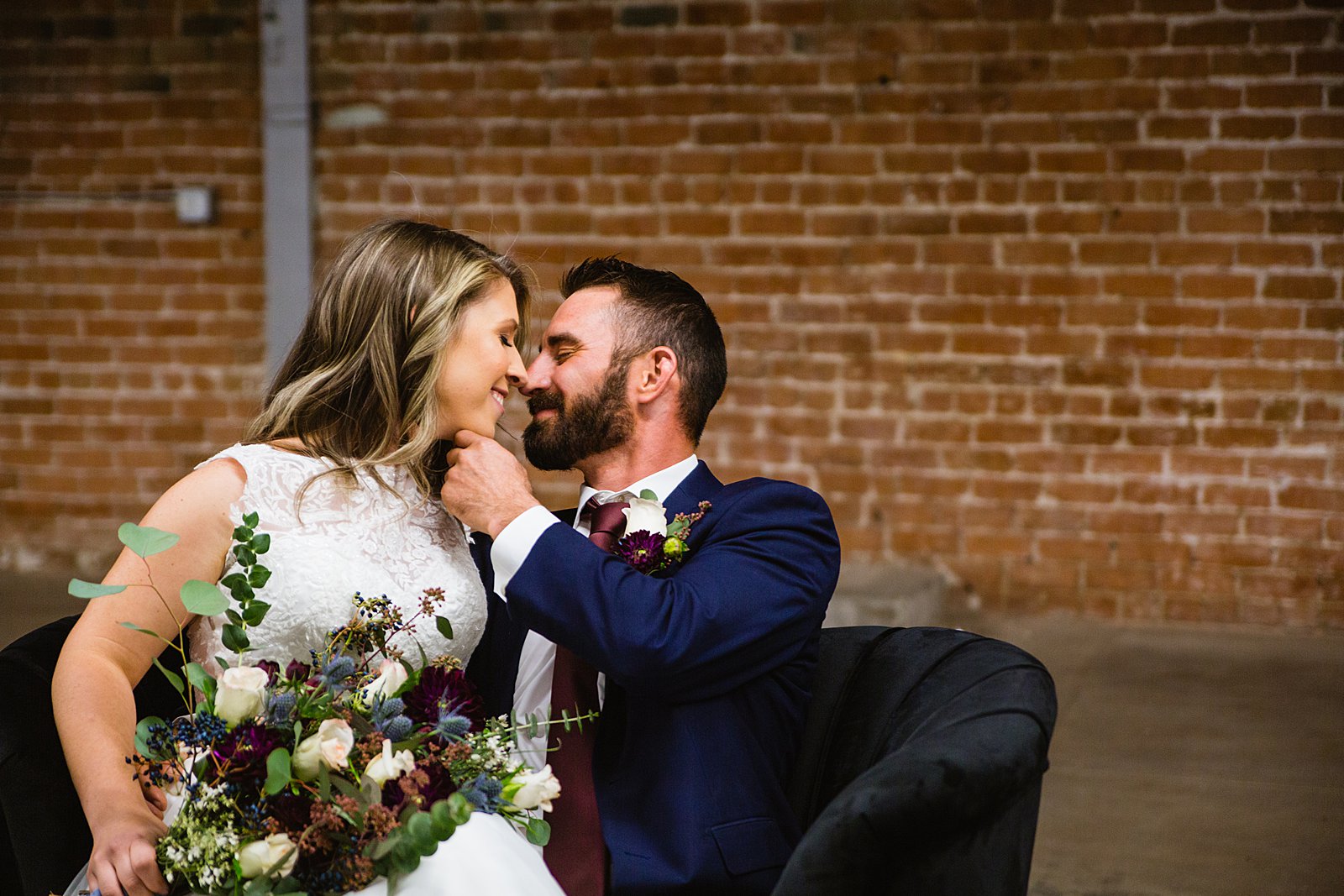 Bride and Groom share an intimate moment at their Sunkist Warehouse wedding by Arizona wedding photographer PMA Photography.