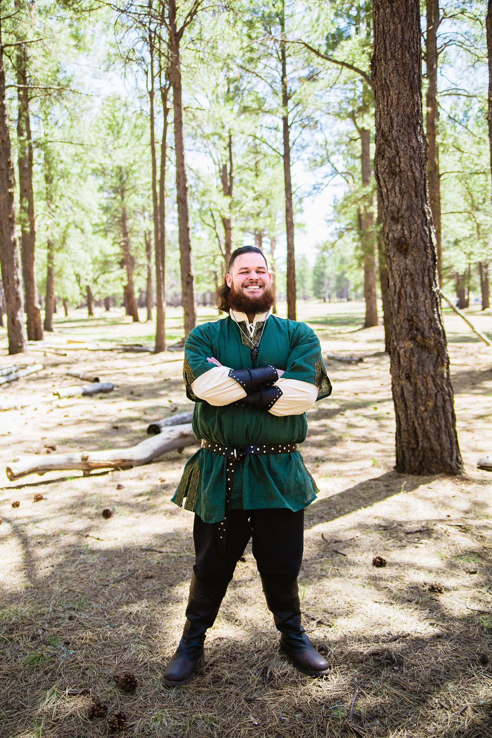 Groom's forest green renaissance inspired outfit for his Van Dickson Ranch wedding by PMA Photography.