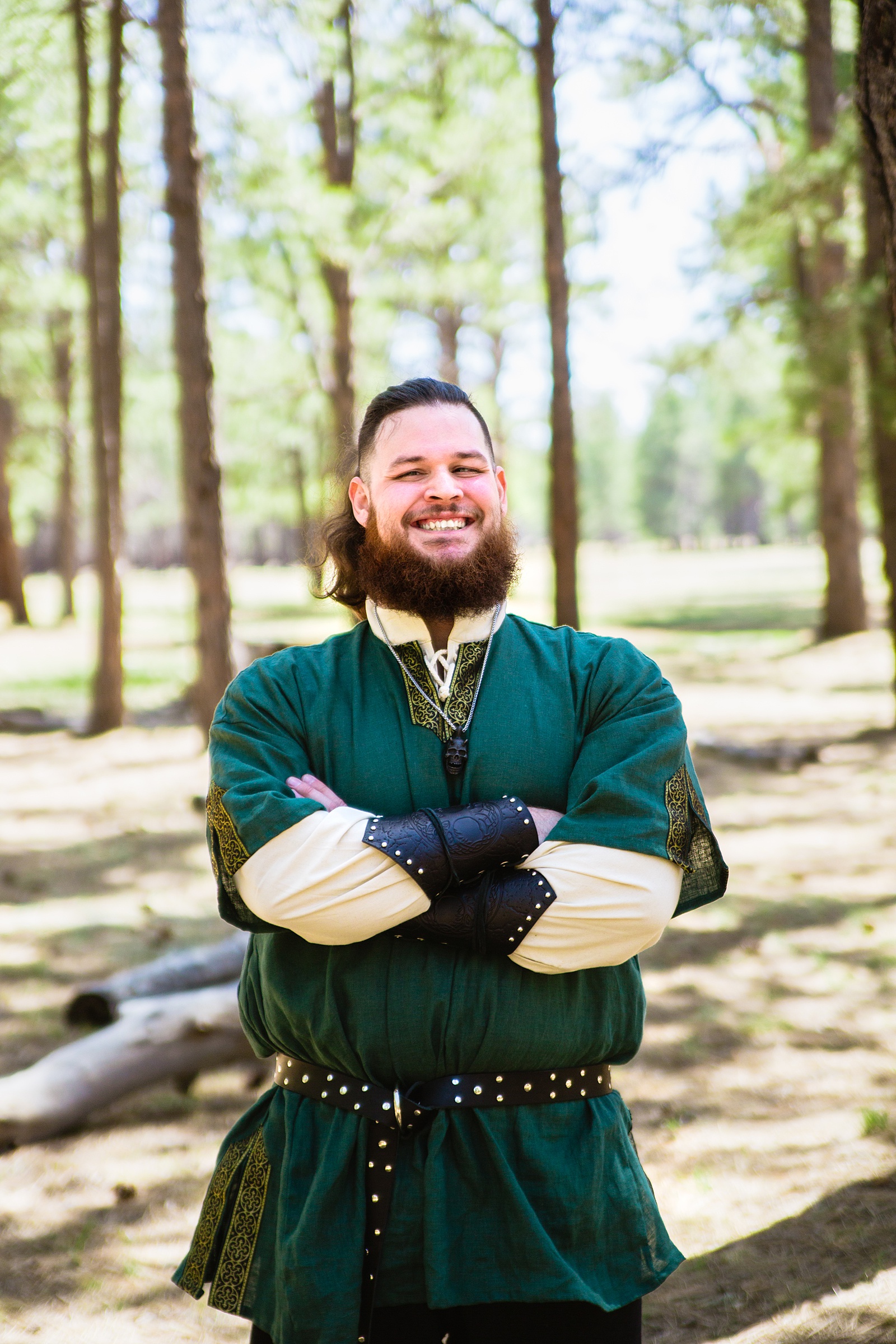 Groom's forest green renaissance inspired outfit for his Van Dickson Ranch wedding by PMA Photography.