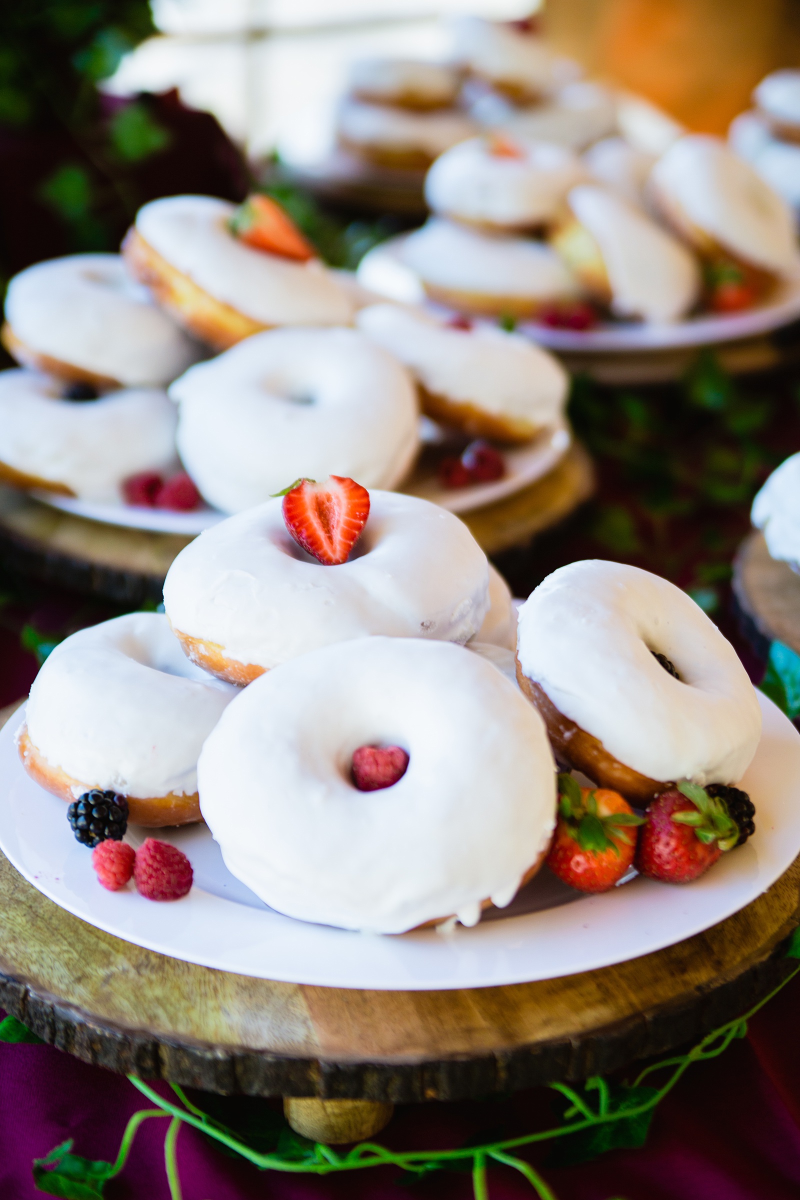 Donut and berry dessert table at Arizona Nordic Village wedding reception by Arizona wedding photographer PMA Photography.