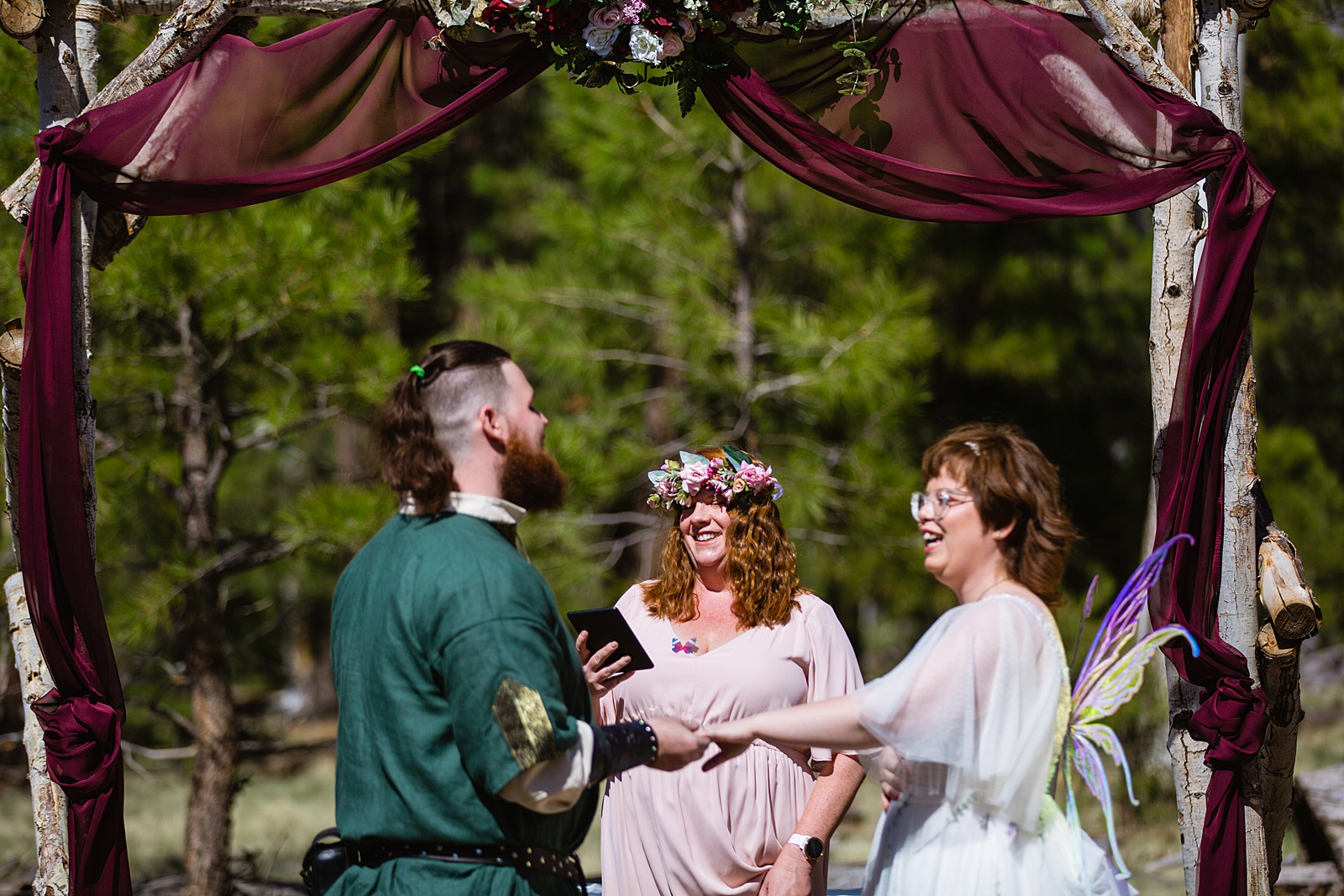 Bride and Groom together during Arizona Nordic Village wedding ceremony by Flagstaff wedding photographer PMA Photography.