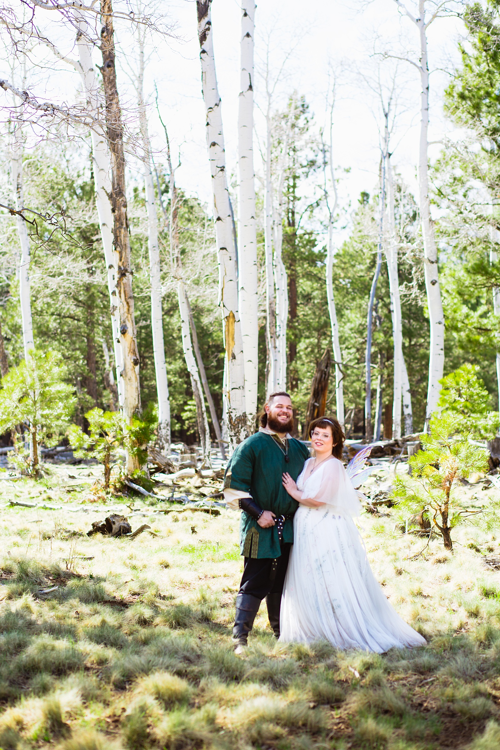 Newlyweds pose for their Arizona Nordic Village wedding by Flagstaff wedding photographer PMA Photography.