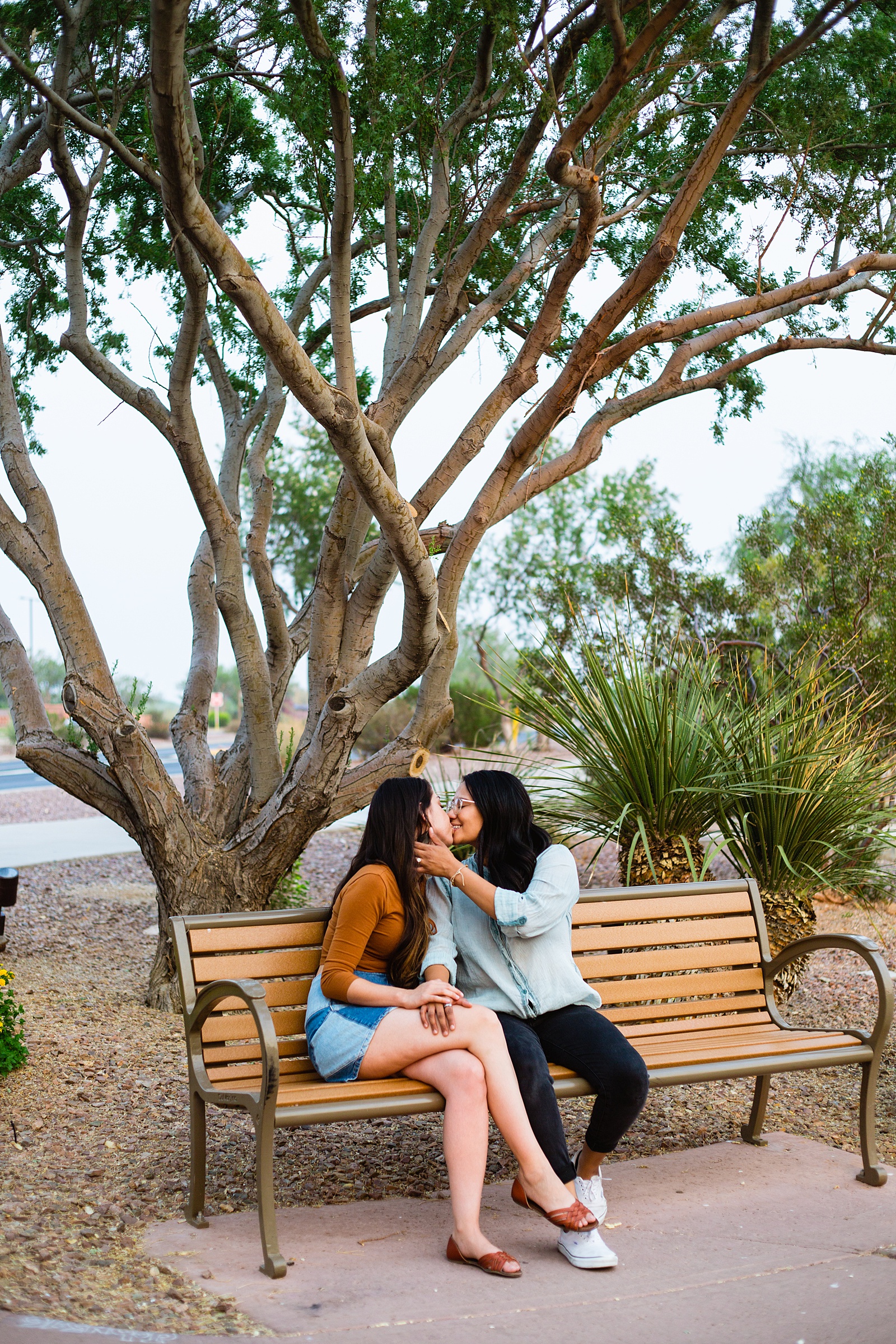 Same sex couple share an intimate moment during their Anthem Park engagement session by Phoenix engagement photographer PMA Photography.