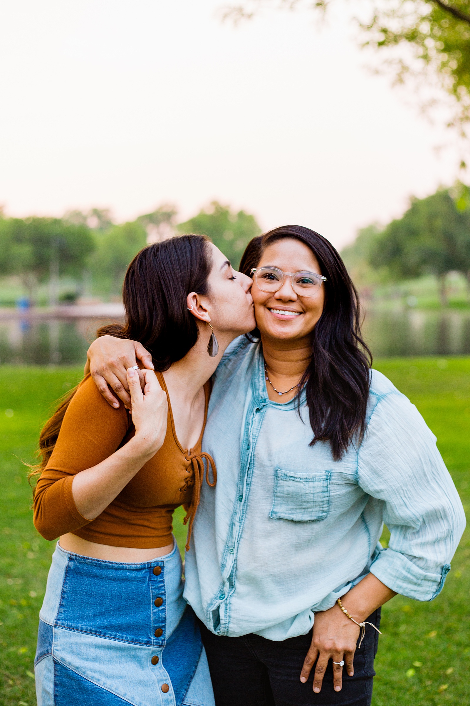 Same sex couple share a kiss during their Phoenix engagement session by Arizona wedding photographer PMA Photography.