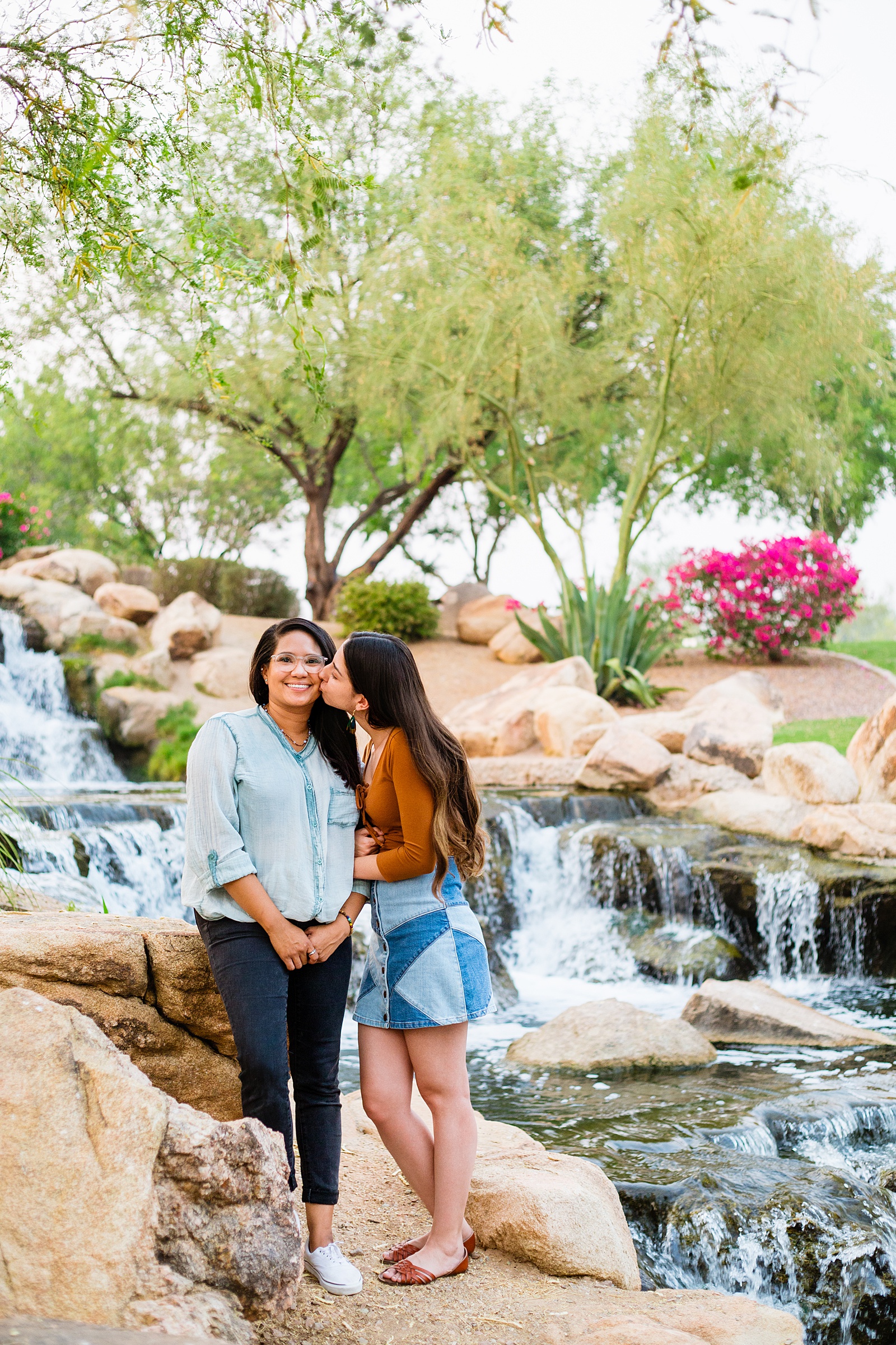 LGBTQ+ couple share a kiss during their Anthem Park engagement session by Phoenix wedding photographer PMA Photography.
