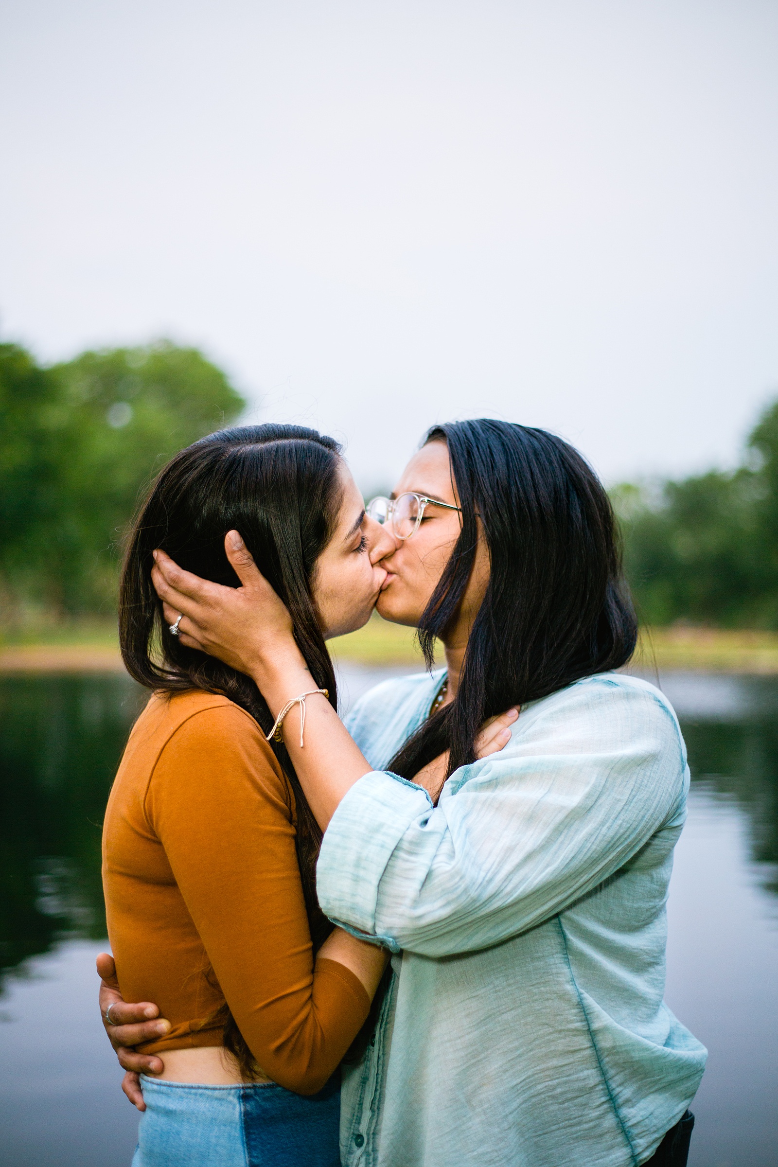 LGBTQ+ couple share a kiss during their Phoenix engagement session by Arizona wedding photographer PMA Photography.