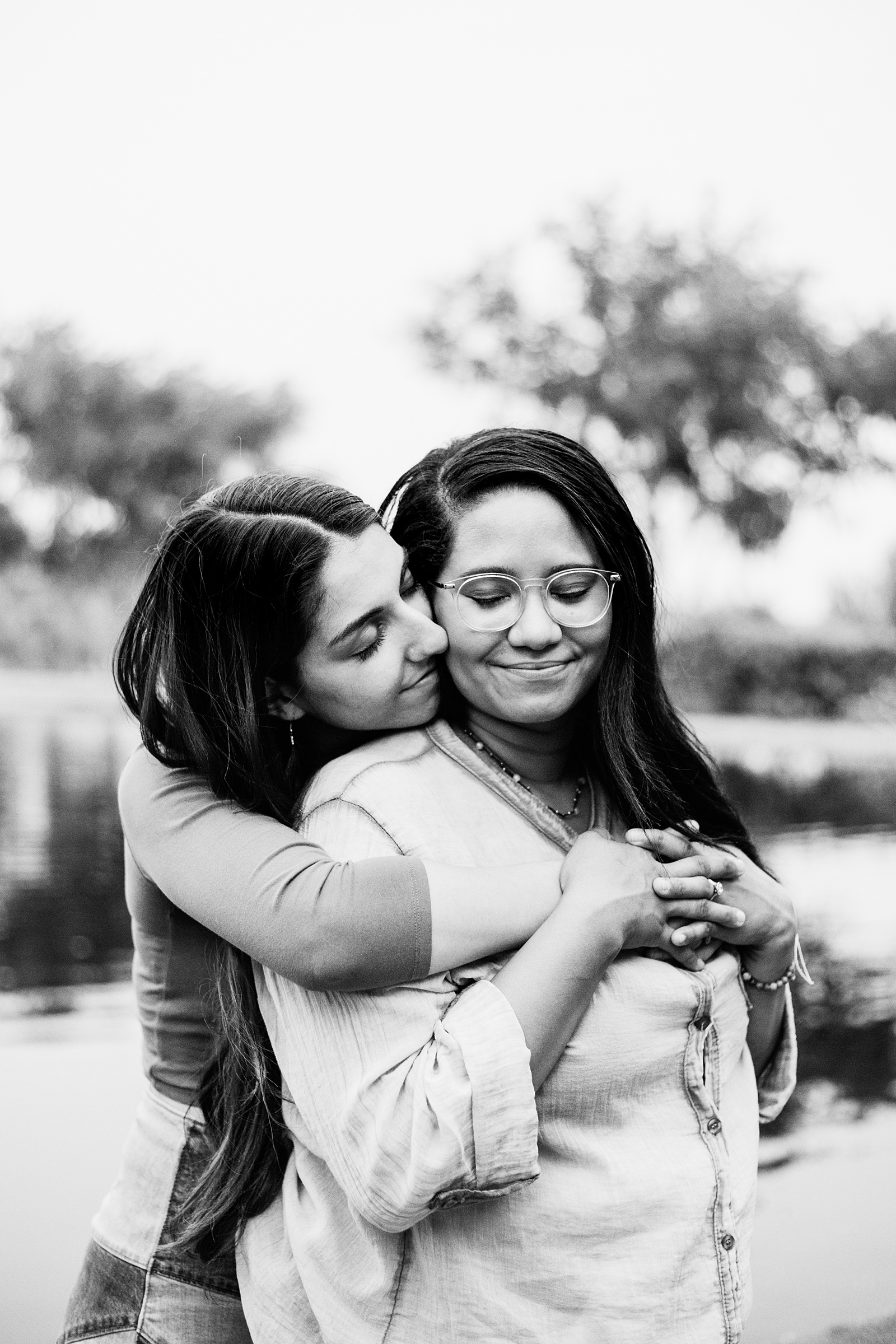 LGBTQ+ couple share an intimate moment during their Anthem Park engagement session by Phoenix engagement photographer PMA Photography.