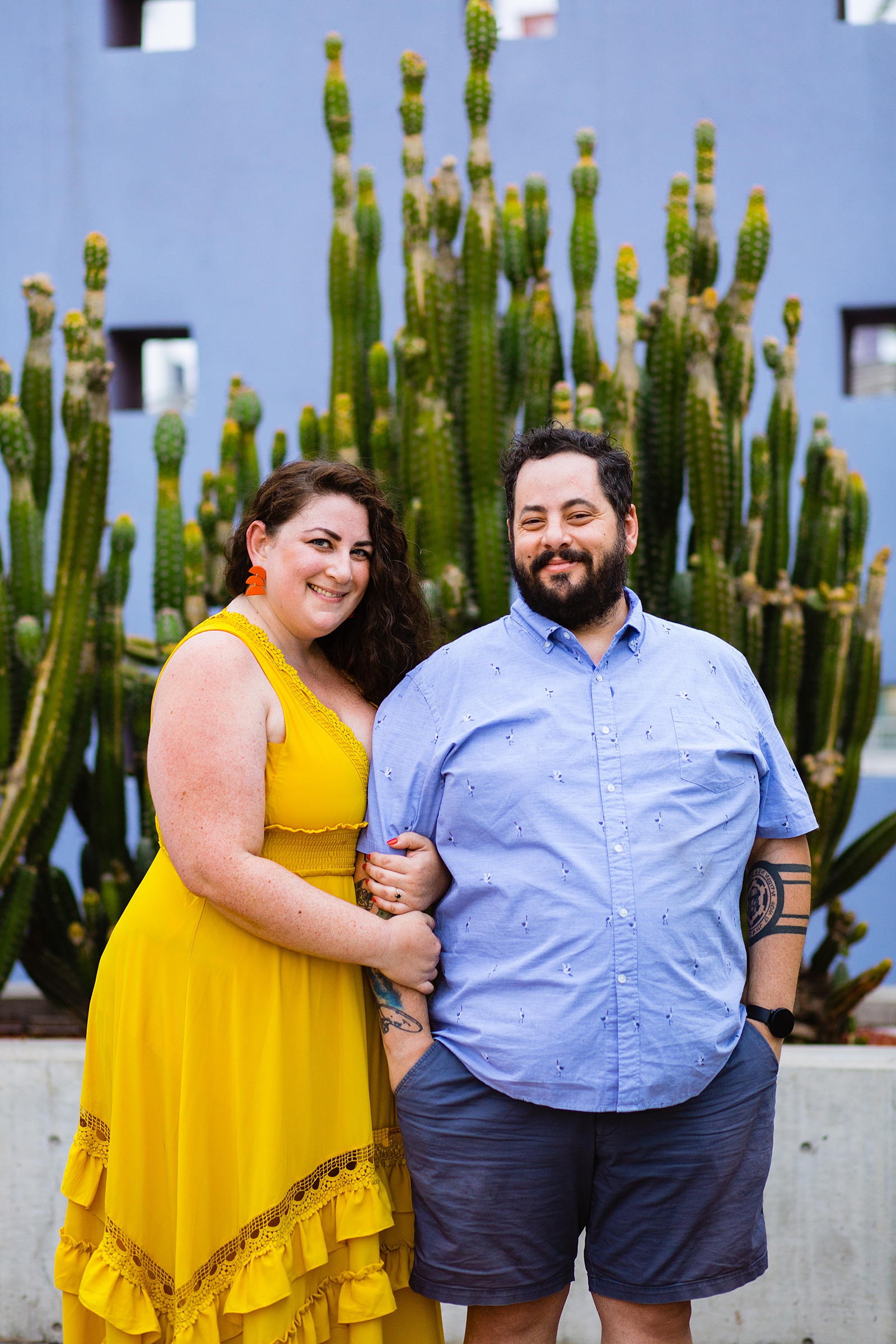 Couple pose during their Mesa engagement session by Arizona wedding photographer PMA Photography.