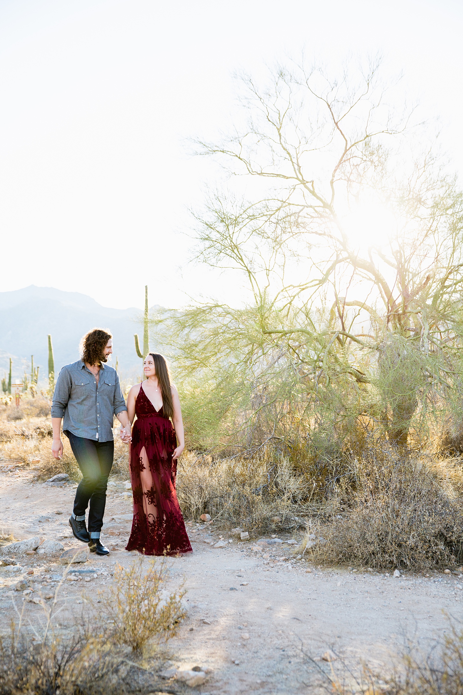 Couple walking together during their White Tanks engagement session by Phoenix engagement photographer PMA Photography.