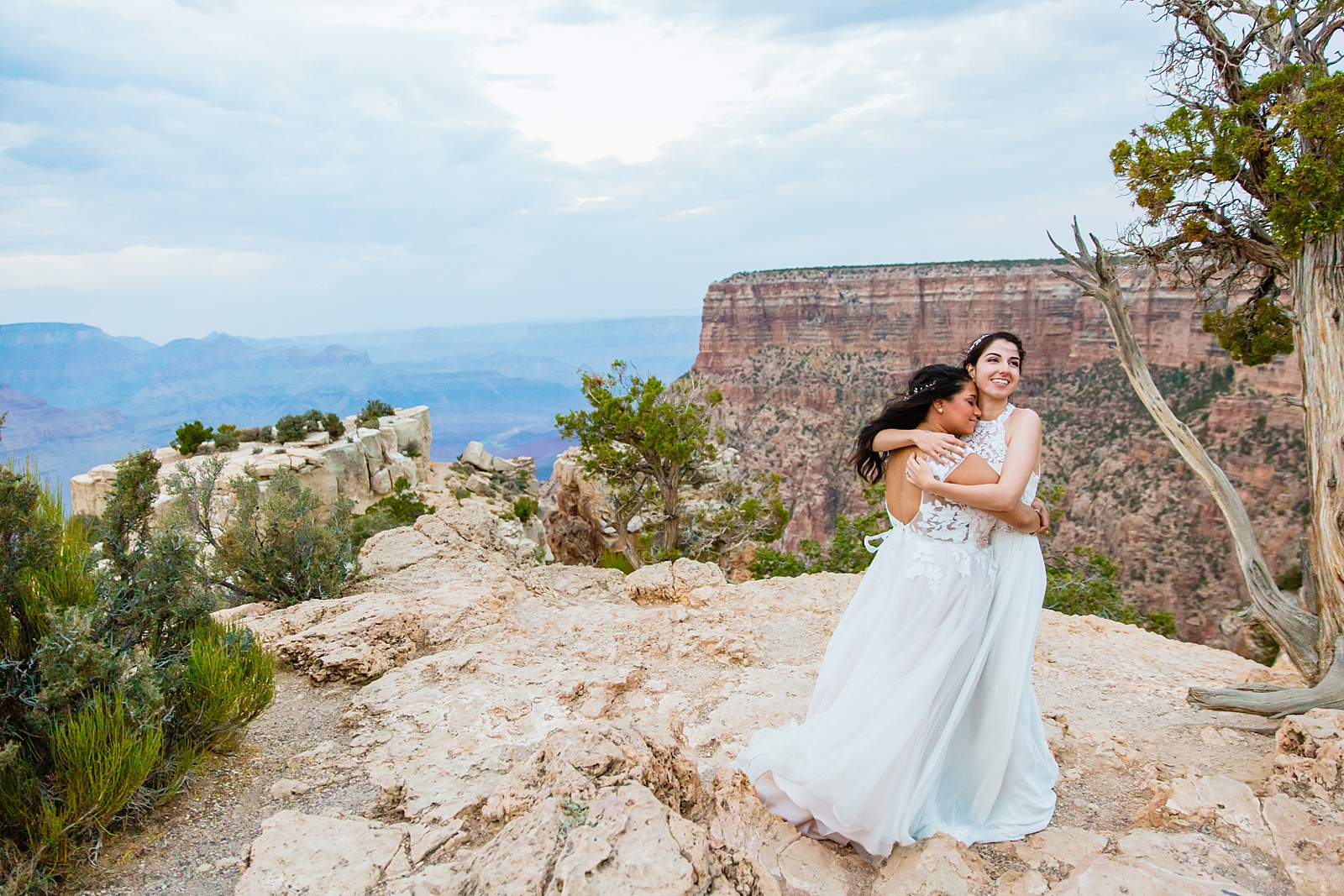 Same sex couple share an intimate moment at their Moran Point elopement by Arizona elopement photographer PMA Photography.