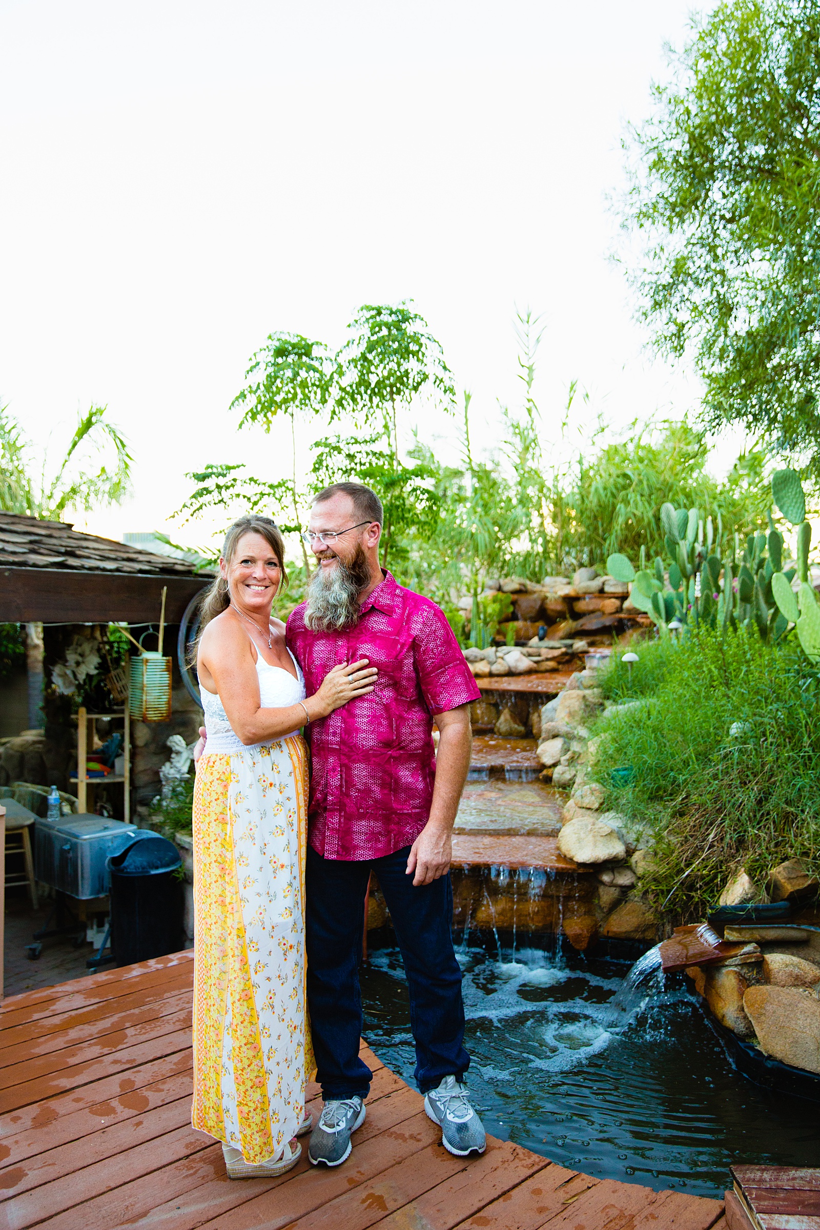 Couple pose for their Backyard engagement session by Phoenix wedding photographer PMA Photography.