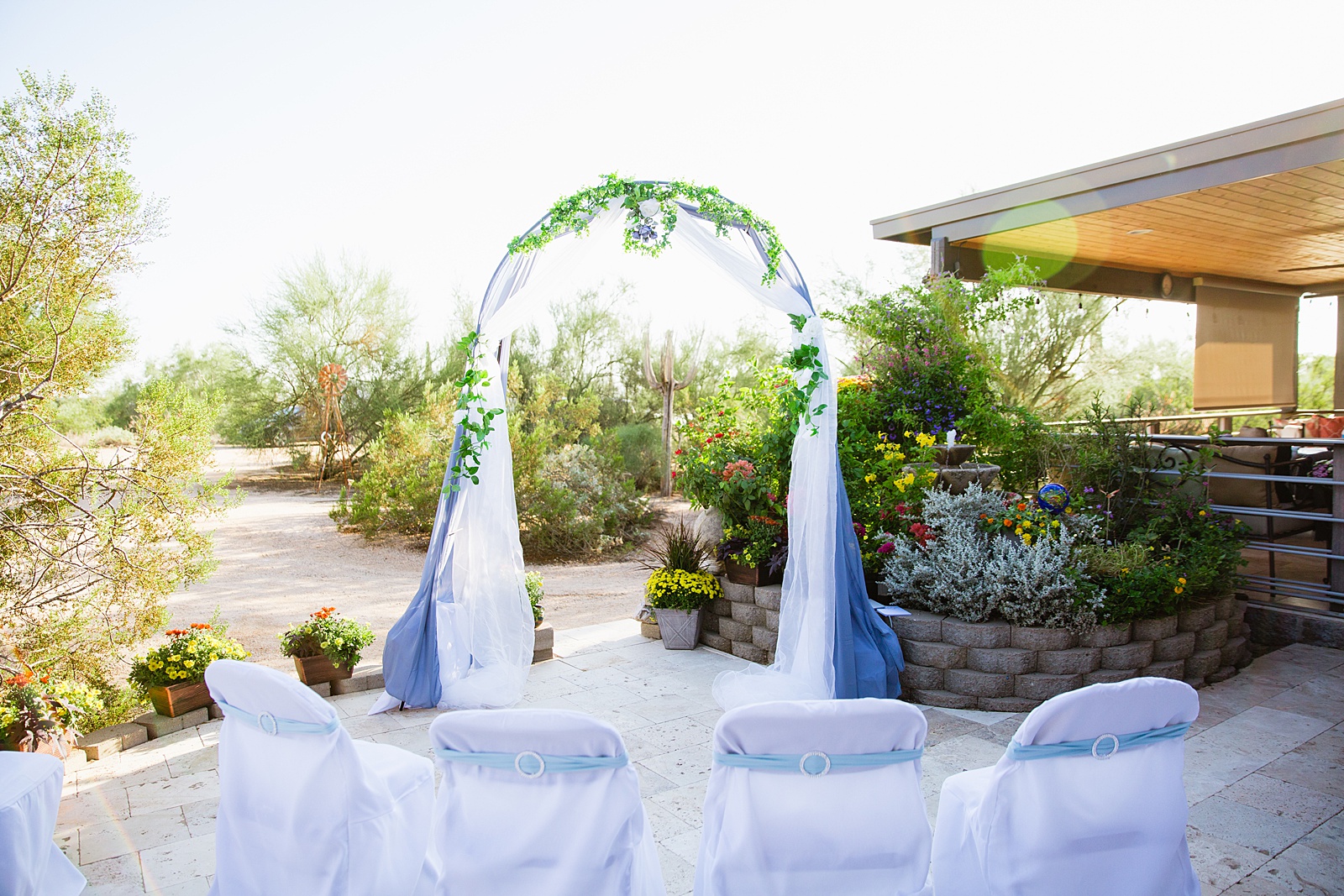 Simple garden ceremony set up for a backyard elopement in Scottsdale, Arizona by elopement photographers PMA Photography.