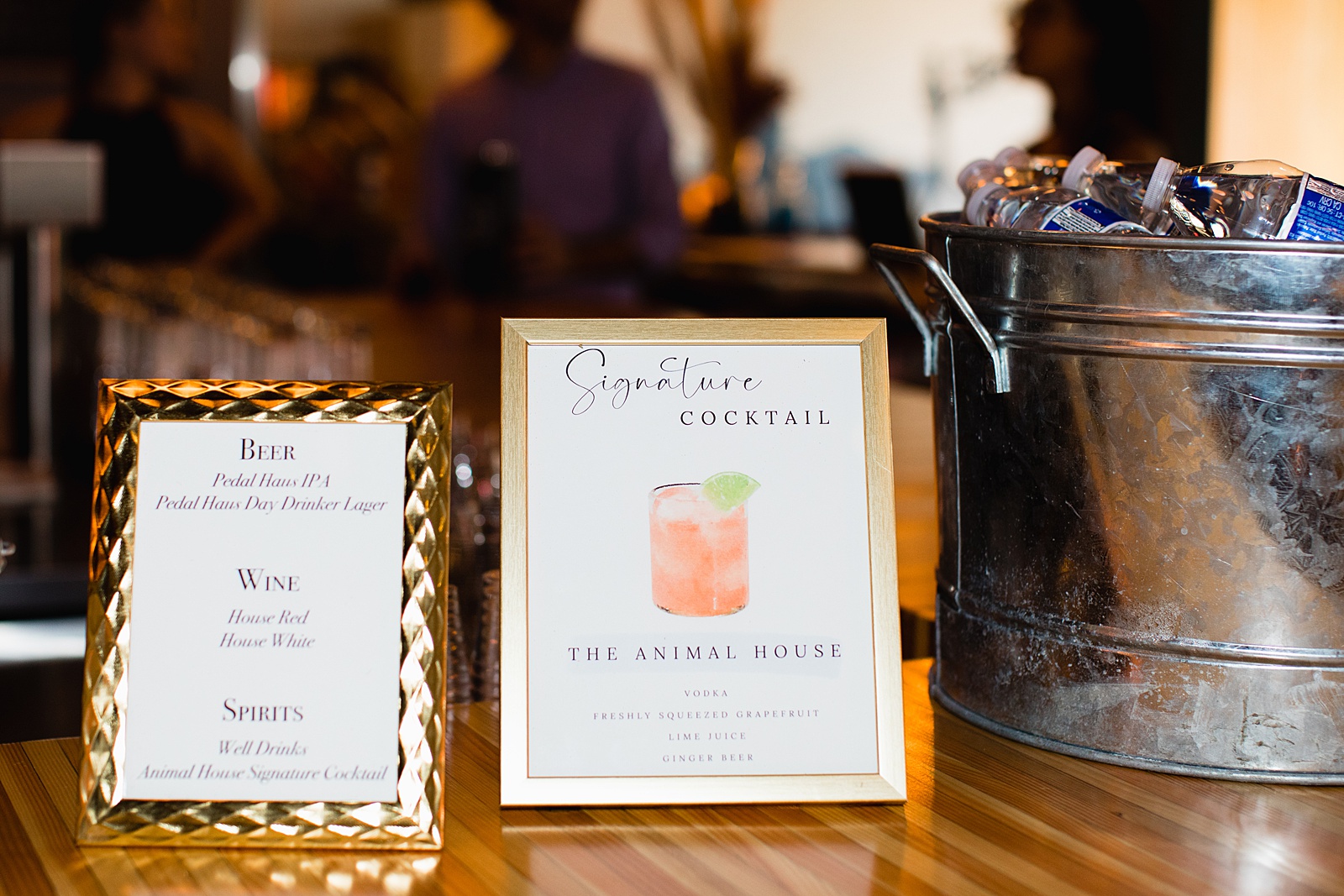 Water color Signature Cocktail sign on the bar at a MonOrchid wedding by Arizona wedding photographer PMA Photography.