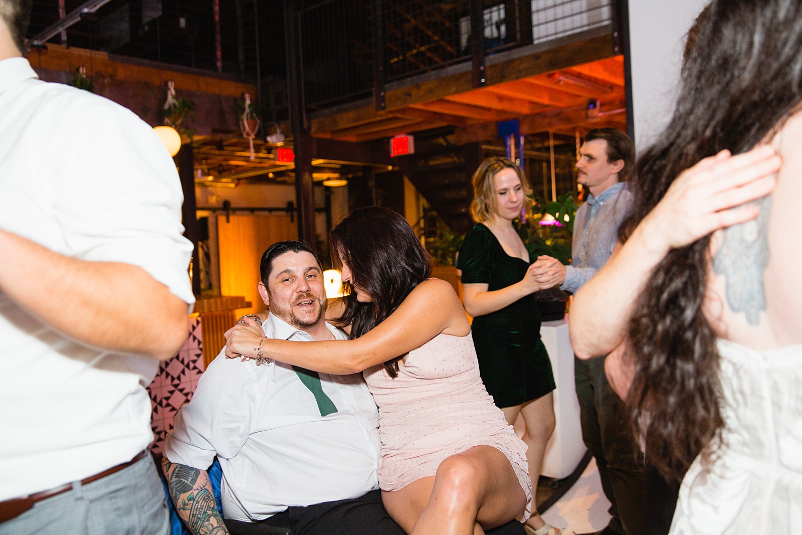 Guests dancing together at a MonOrchid wedding reception by Phoenix wedding photographer PMA Photography