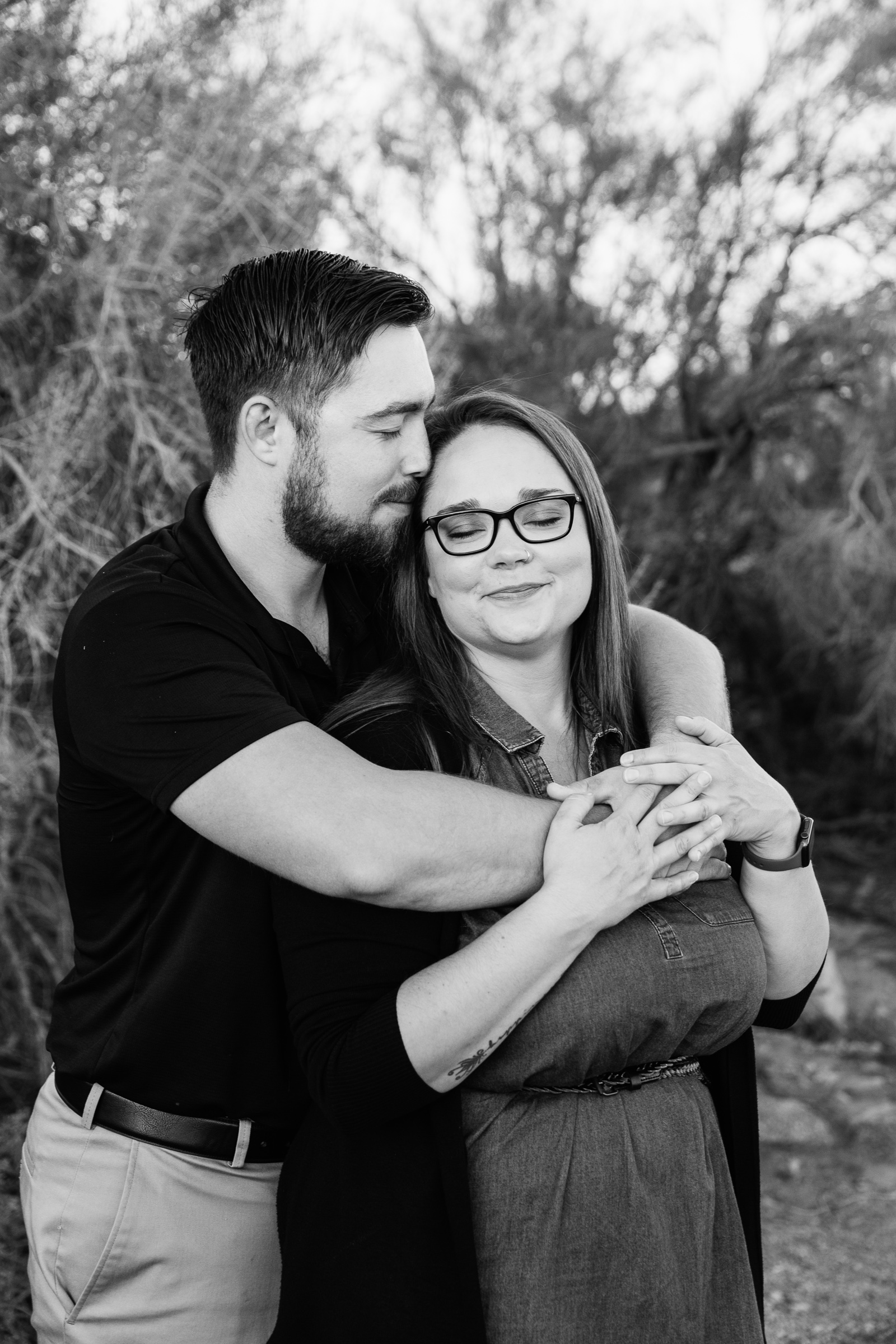 Couple share an intimate moment during their Papago Park engagement session by Phoenix engagement photographer PMA Photography.