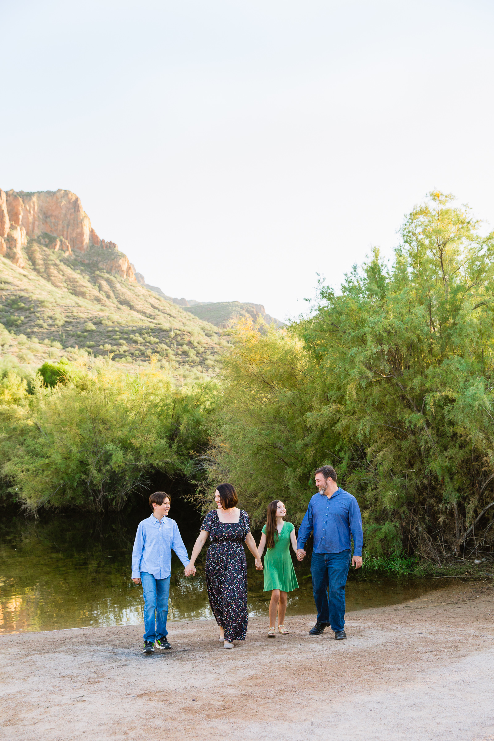 Family walking together during their Phoenix family session by Arizona family photographer PMA Photography.