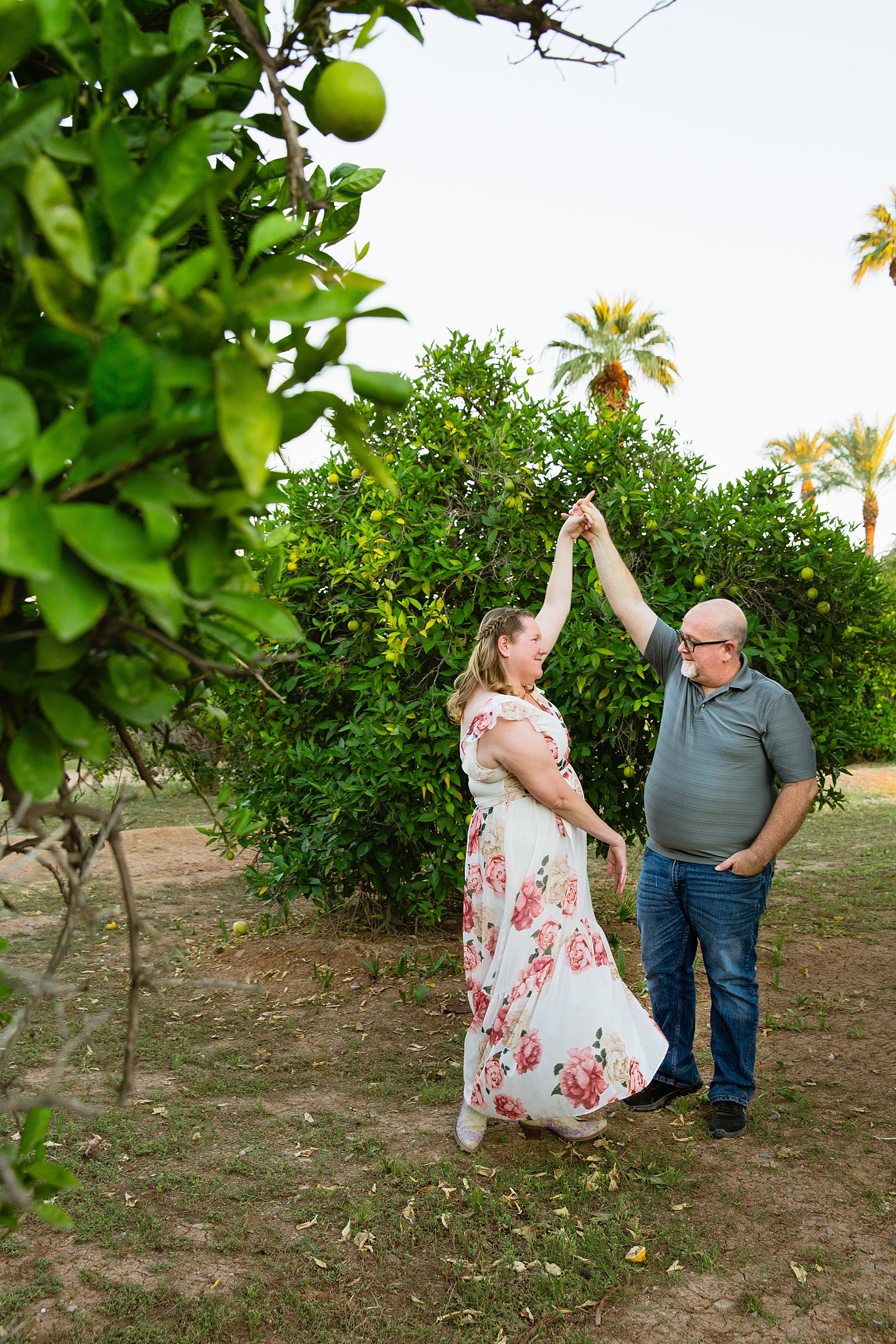 Couple dance together during their Sahuaro Ranch engagement session by Glendale engagement photographer PMA Photography.