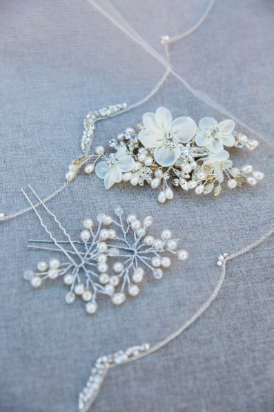 Bride's wedding day hair clips with pearls and crystals by Arizona wedding photographer PMA Photography.