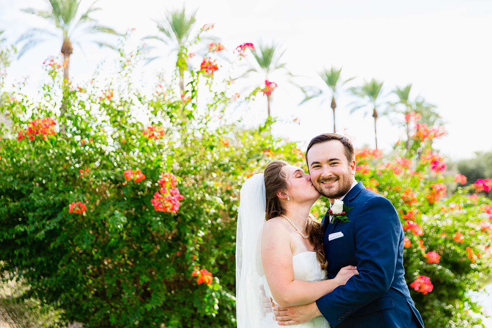 Bride and Groom share a kiss during their Ocotillo Oasis wedding by Arizona wedding photographer PMA Photography.