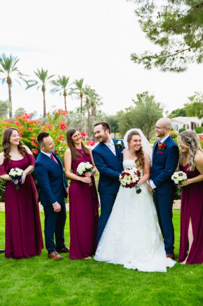 Bridal party laughing together at Ocotillo Oasis wedding by Phoenix wedding photographer PMA Photography.