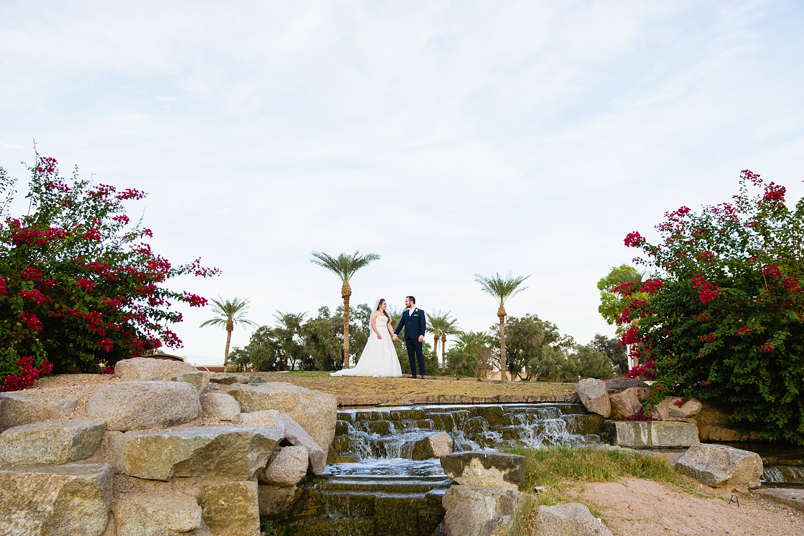 Bride and Groom pose for their Ocotillo Oasis wedding by Phoenix wedding photographer PMA Photography.