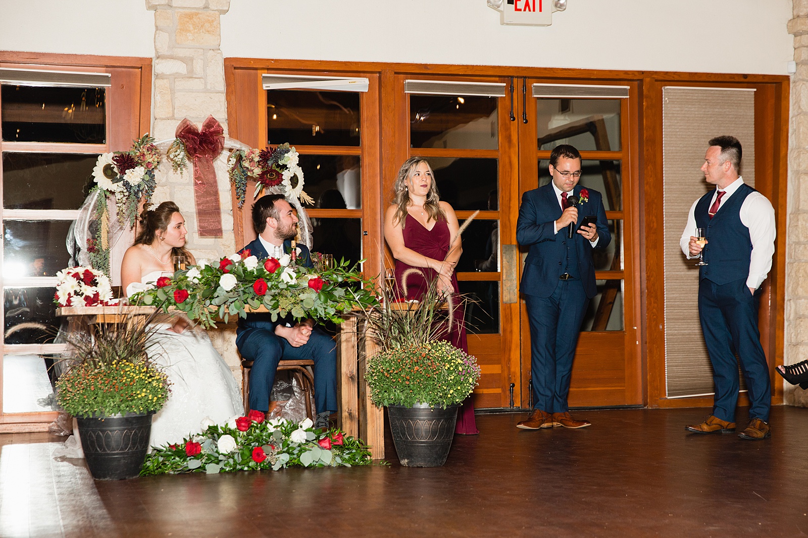 Toasts to the bride and groom at Ocotillo Oasis wedding reception by Phoenix wedding photographer PMA Photography.