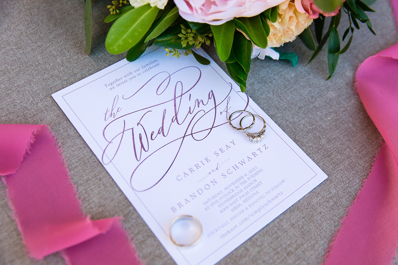 Romantic inspired pink and white wedding invitations with wedding rings by Arizona wedding photographer PMA Photography.
