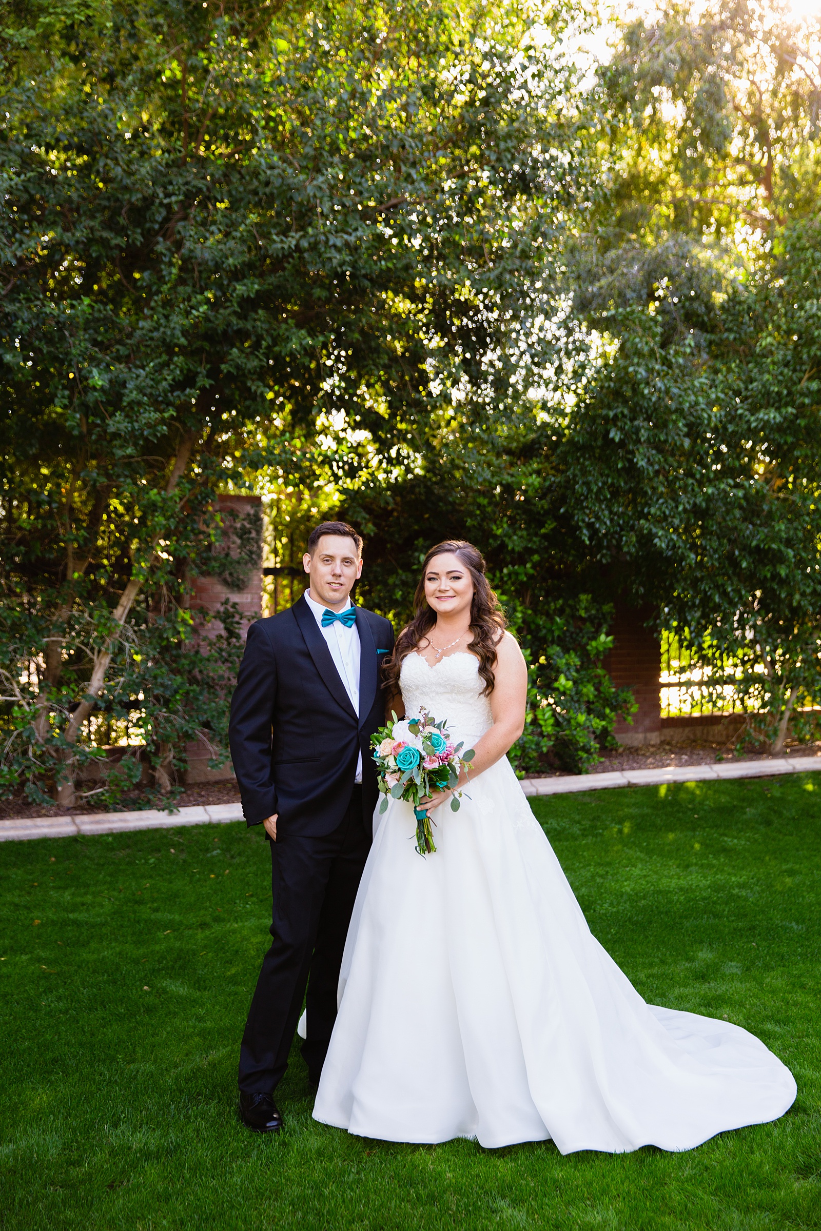 Bride and groom pose during their Stonebridge Manor wedding by Arizona wedding photographer PMA Photography.